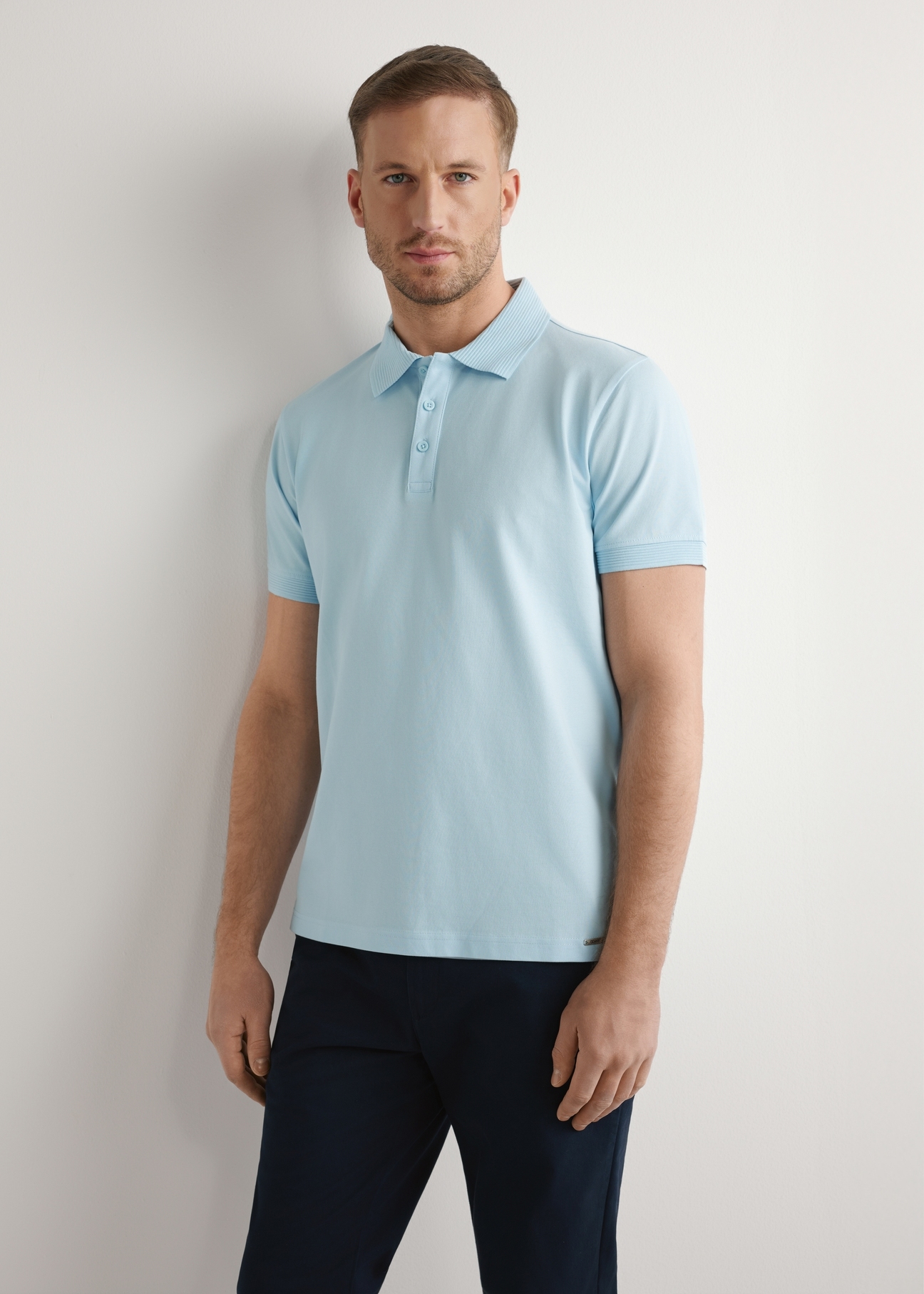 Men's light blue polo shirt POLMT-0089-7A(W26), front view of the product on the model. Half of the silhouette visible.