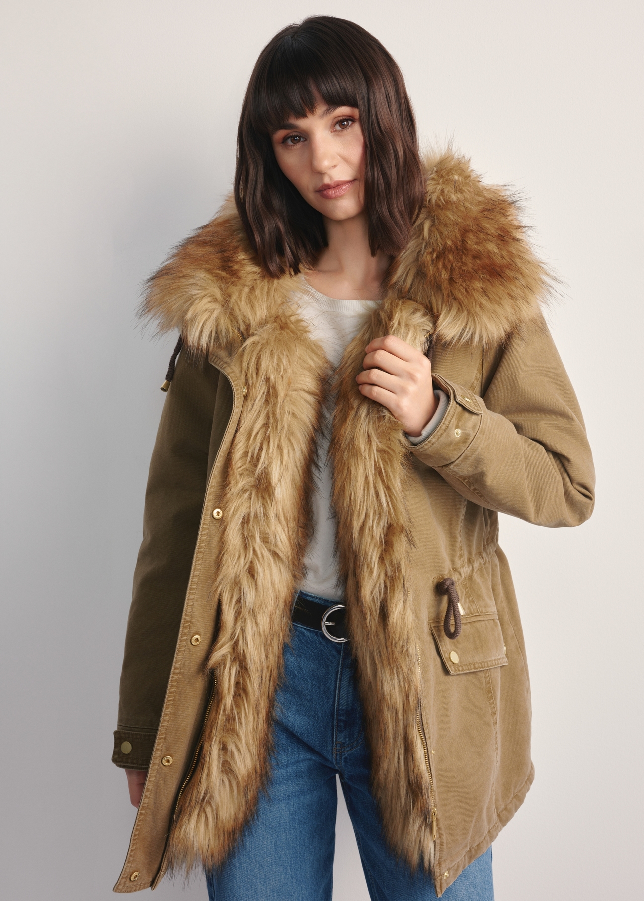 Beige women's jacket with fur KURDT-0612-81(Z25) - front view of the product on a model against a white background. Half of the silhouette visible.