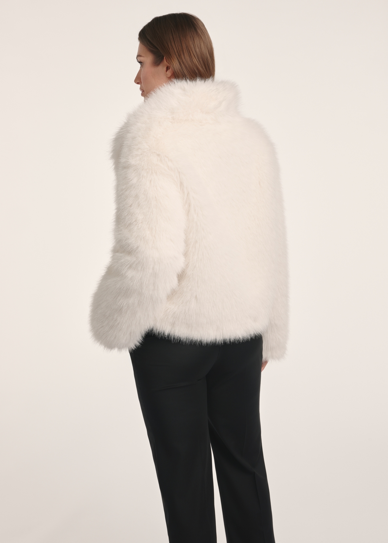 Cream short women's fur coat FUTDP-0077-12(Z25), back view of the product on the model. Half of the silhouette visible.