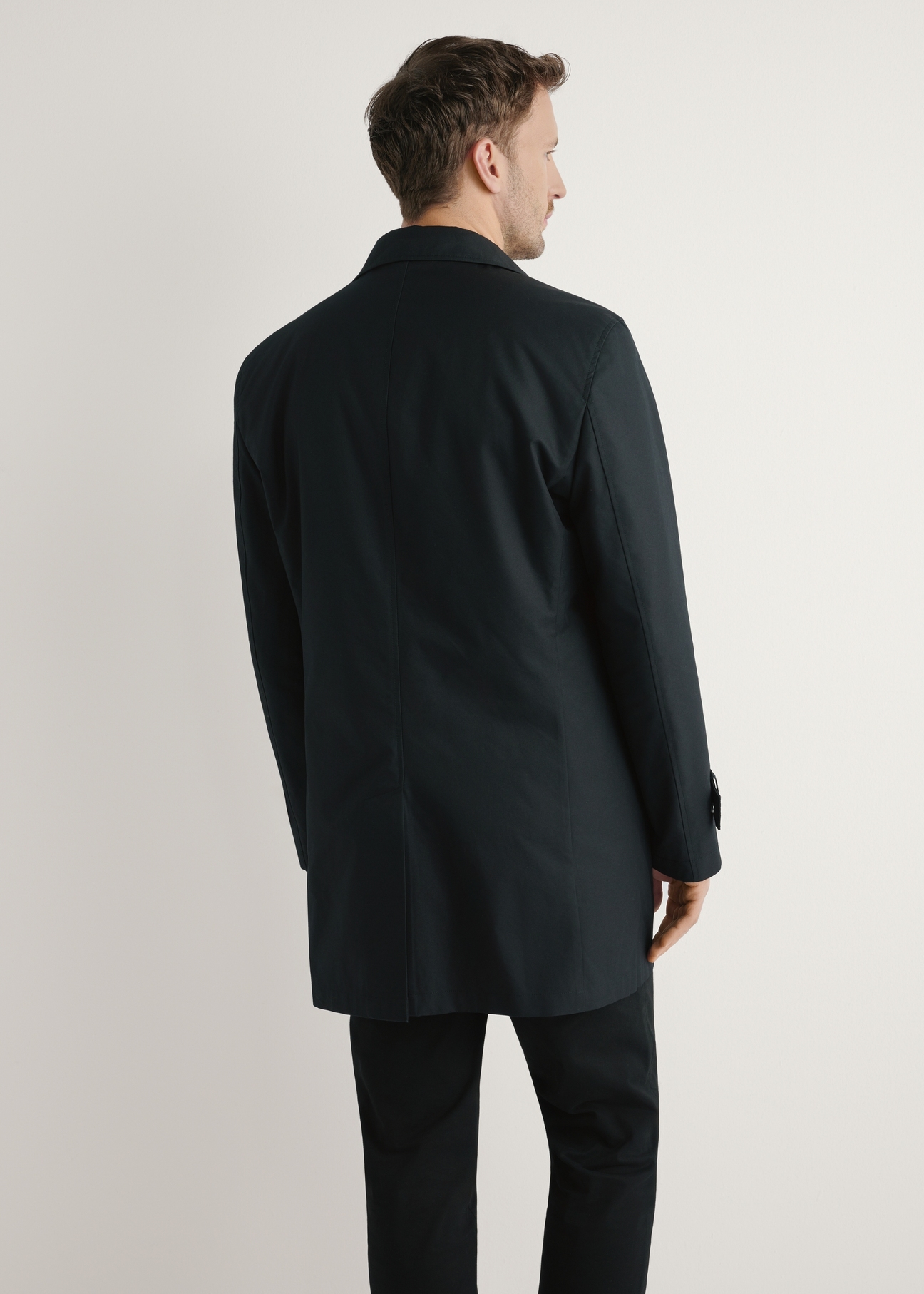 Men's black insulated jacket KURMT-0408-99(W26), product view from the back on the model. Half of the silhouette visible.