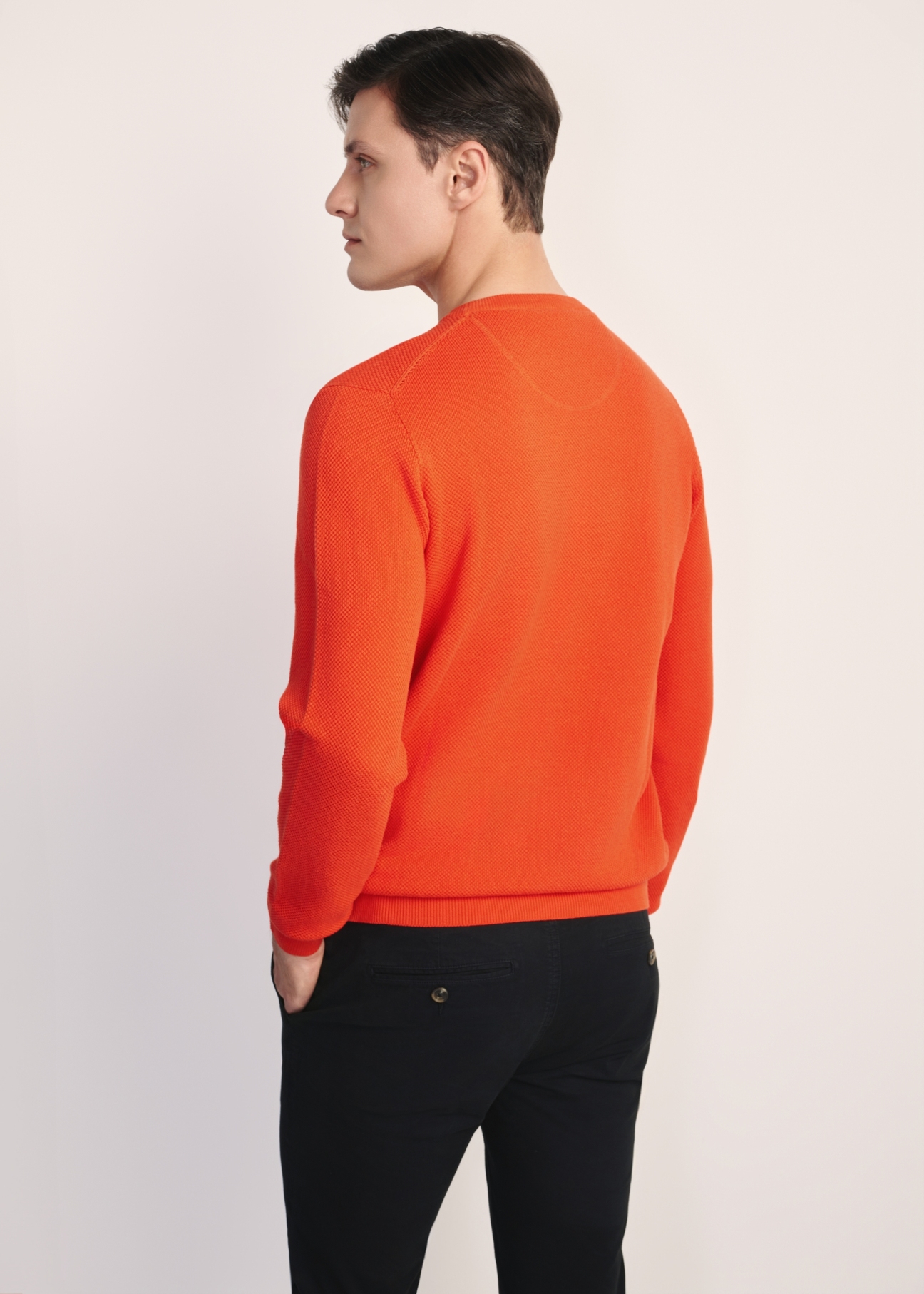 Orange men's sweater SWEMT-0181-30(Z25), product view from the back on the model. Half of the silhouette visible.