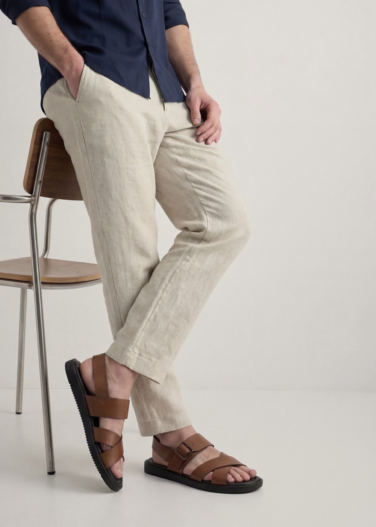 Men's leather sandals in cognac color BUTYM-0537-1F(W26), side view of the product on the model's feet.