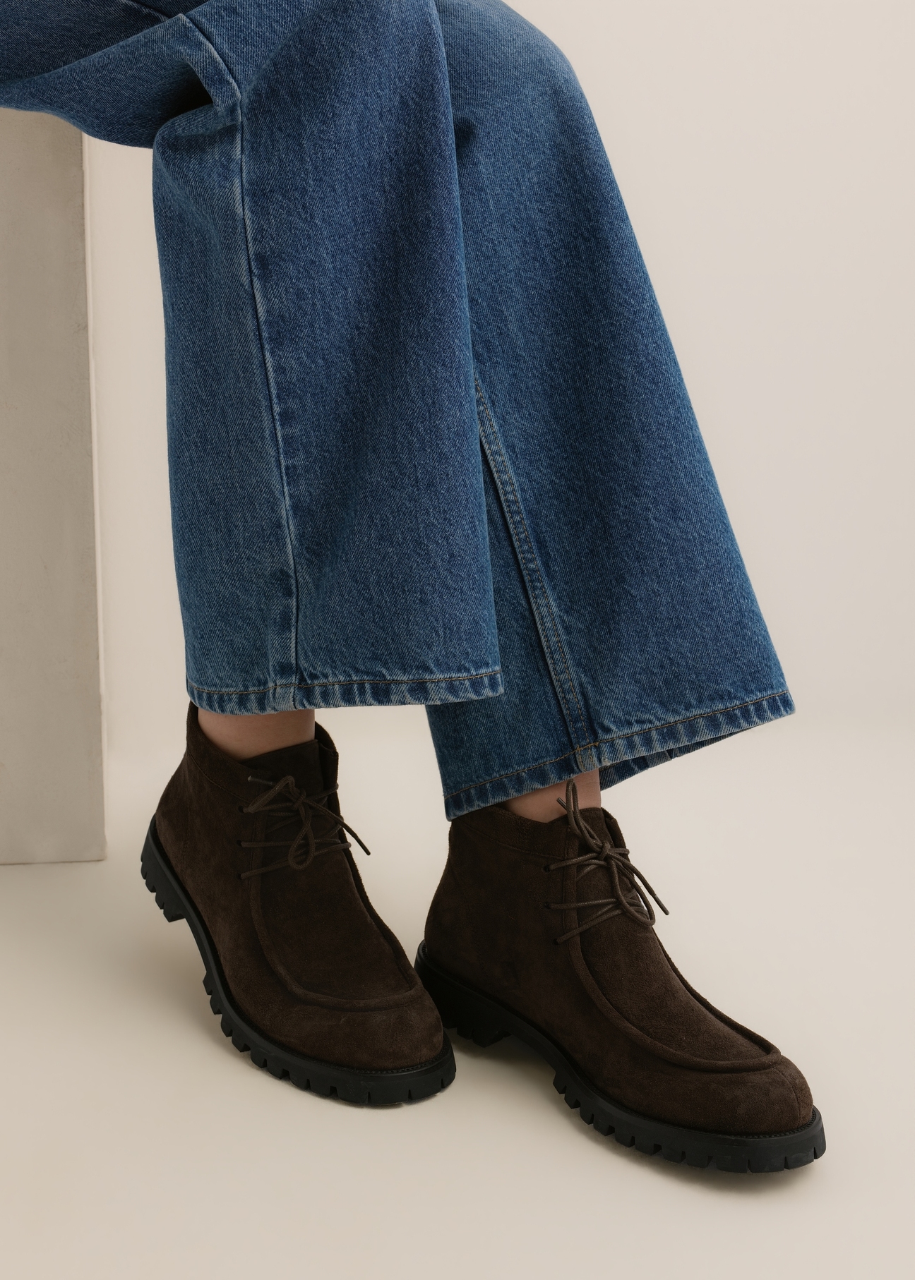 Dark brown suede women's ankle boots (BUTYD-1347-1I(Z26)), angled view of the product on a model's feet, against a light background.