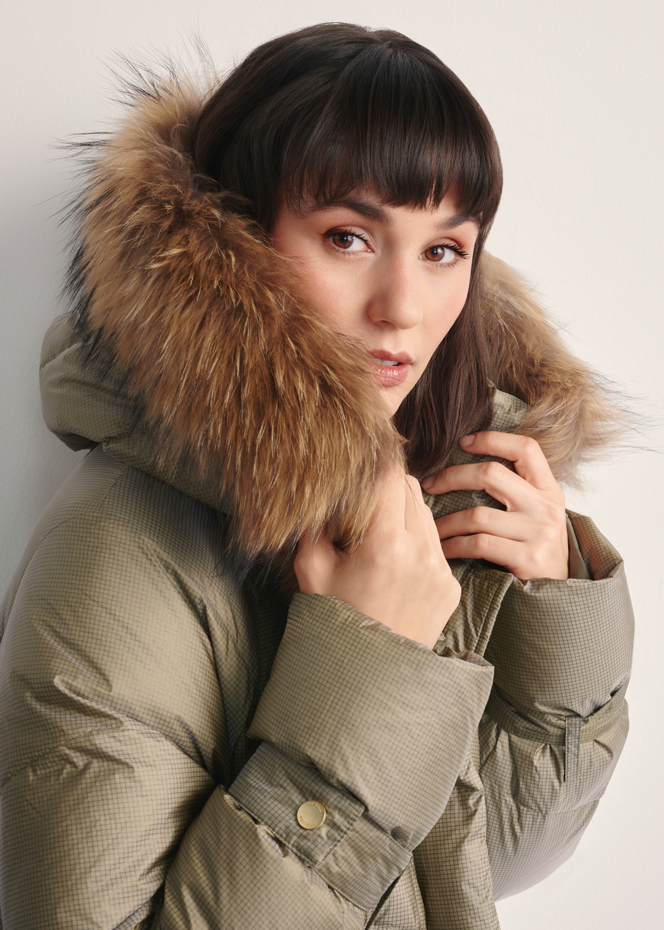 Women's olive jacket with natural insulation KURDT-0619-57(Z25) - close-up of the detail on a white background.
