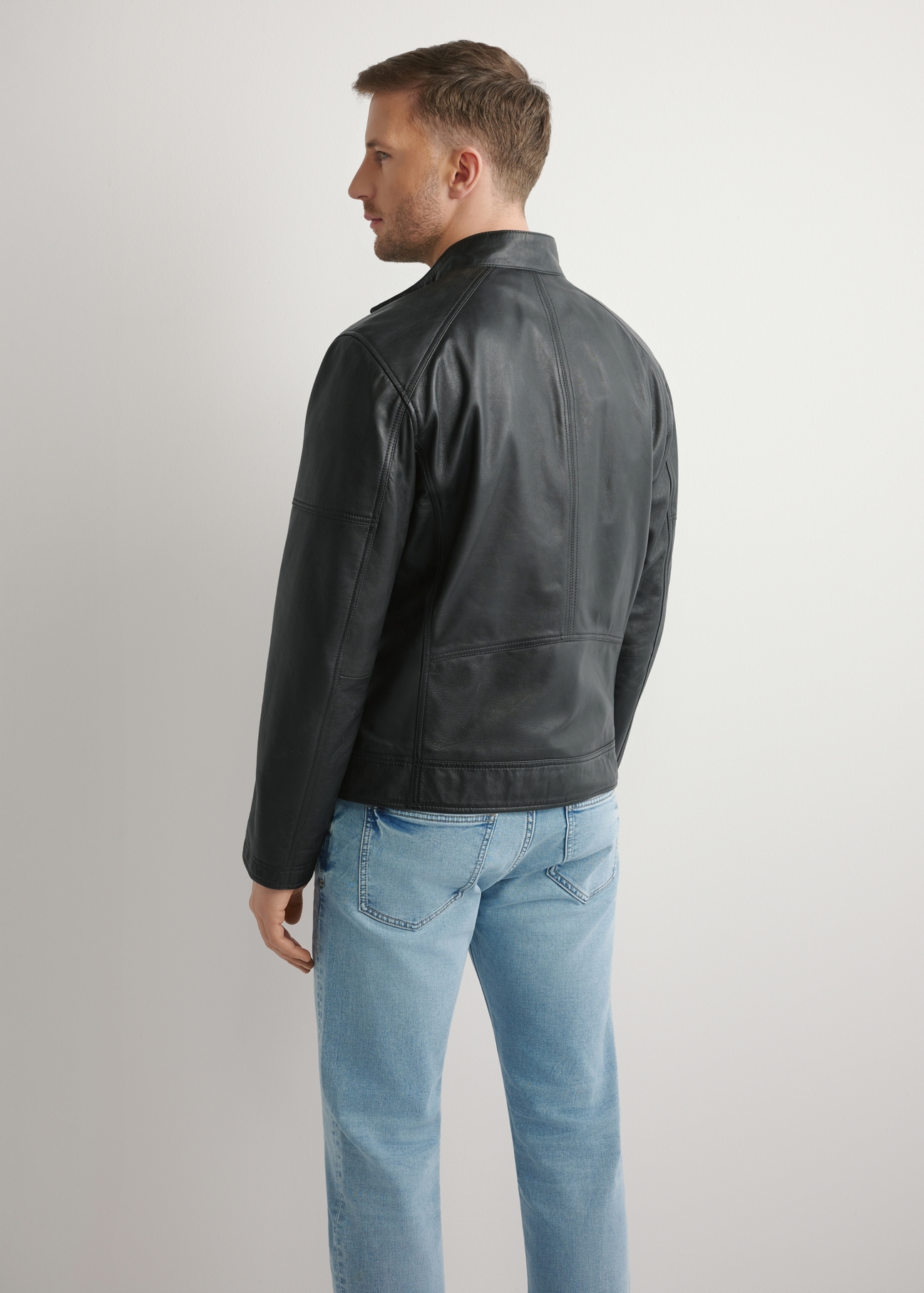 Black men's leather jacket KURMS-0400-99(W26), product view from the back on the model. Half of the silhouette visible.
