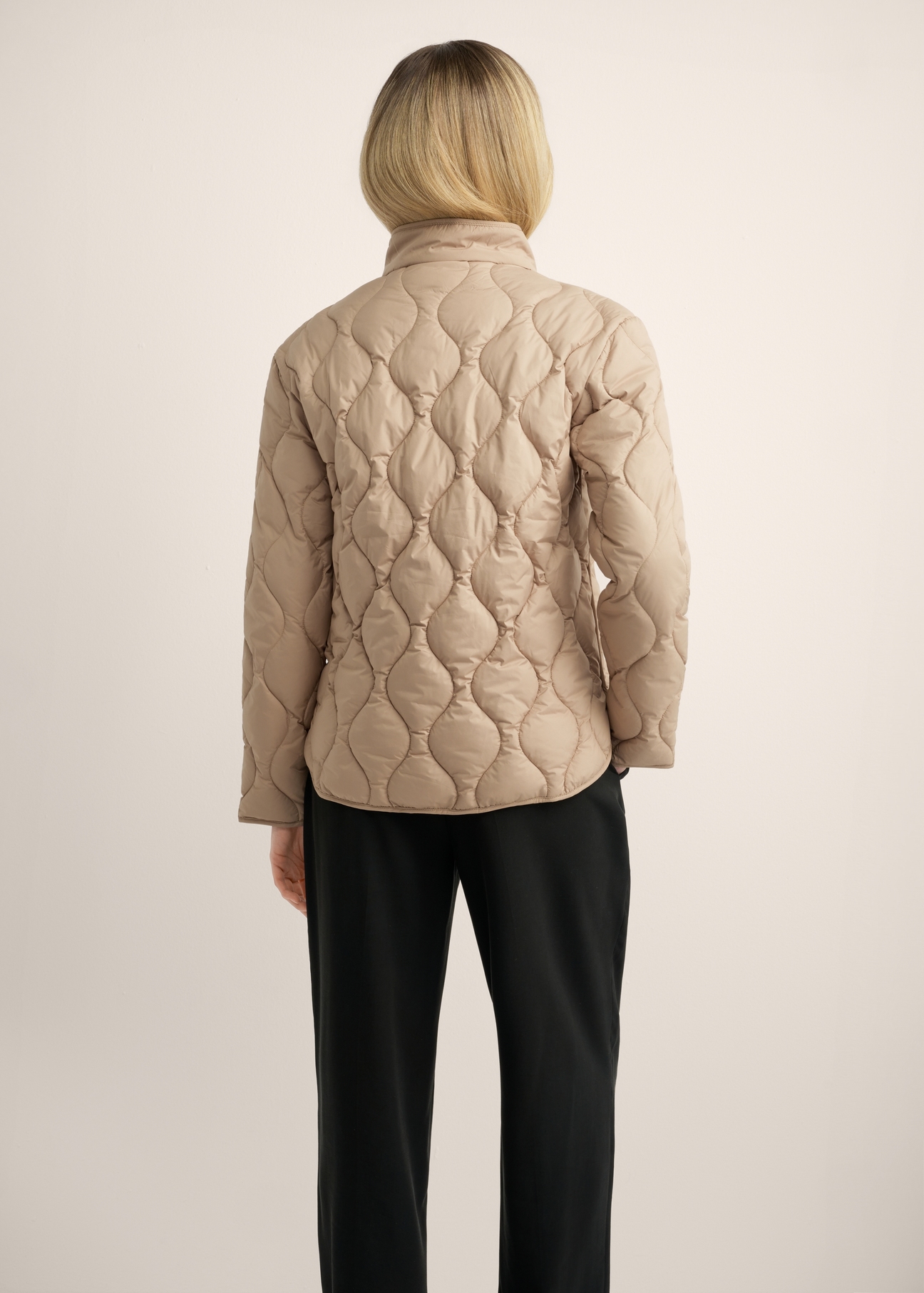 Women's short beige jacket KURDT-0689-1D(Z26), product view from the back on the model. Half of the silhouette visible.