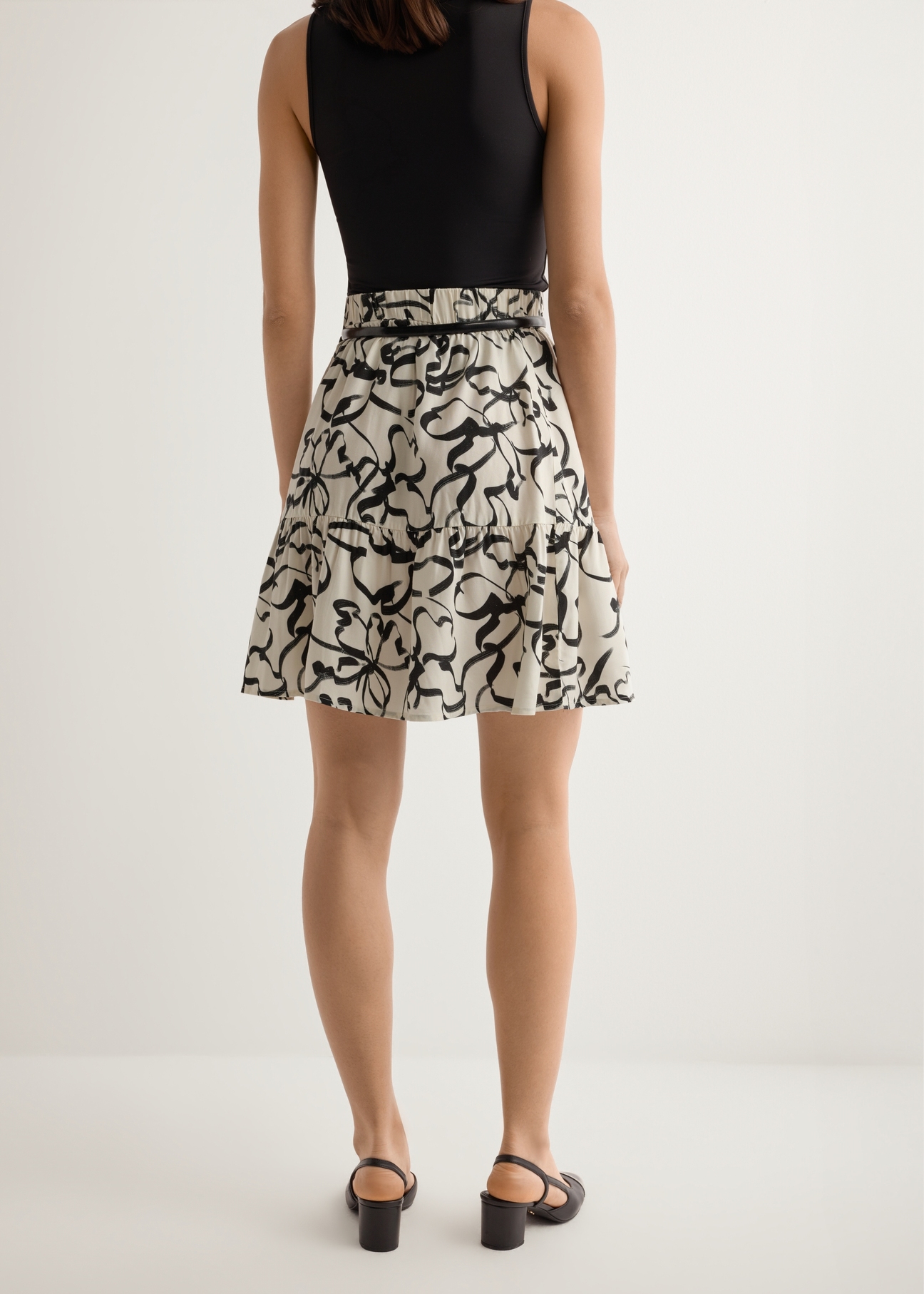 Women's cream patterned skirt SPCDT-0128-1P(W26), back view of the product on the model. Half of the silhouette visible.