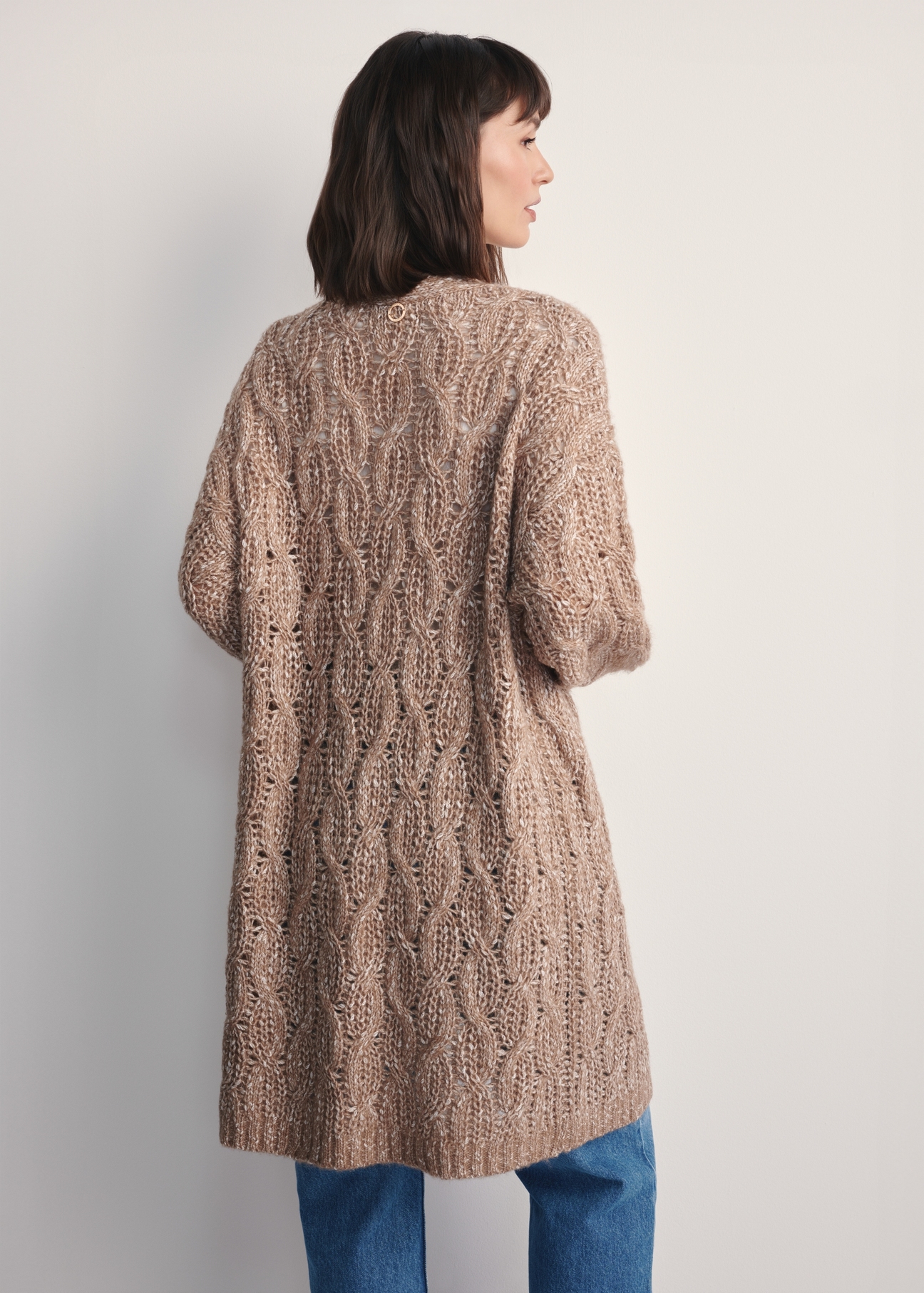 Women's long cardigan in camel color KARDT-0055-24(Z25), product view from the back on the model. Half of the silhouette visible.