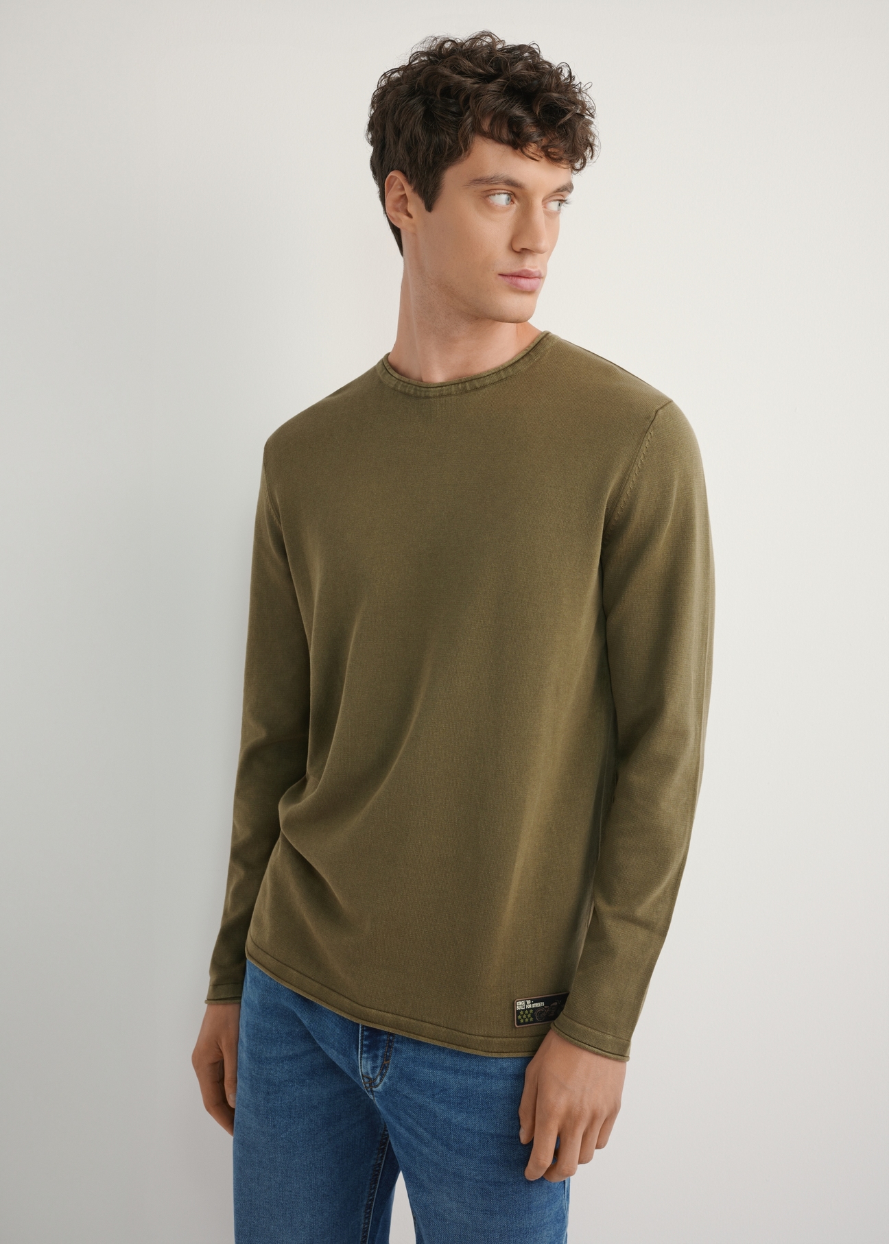 Men's khaki sweater SWEMT-0187-8D(W26) - front view of the product, on a model, against a white background. Half of the silhouette visible.