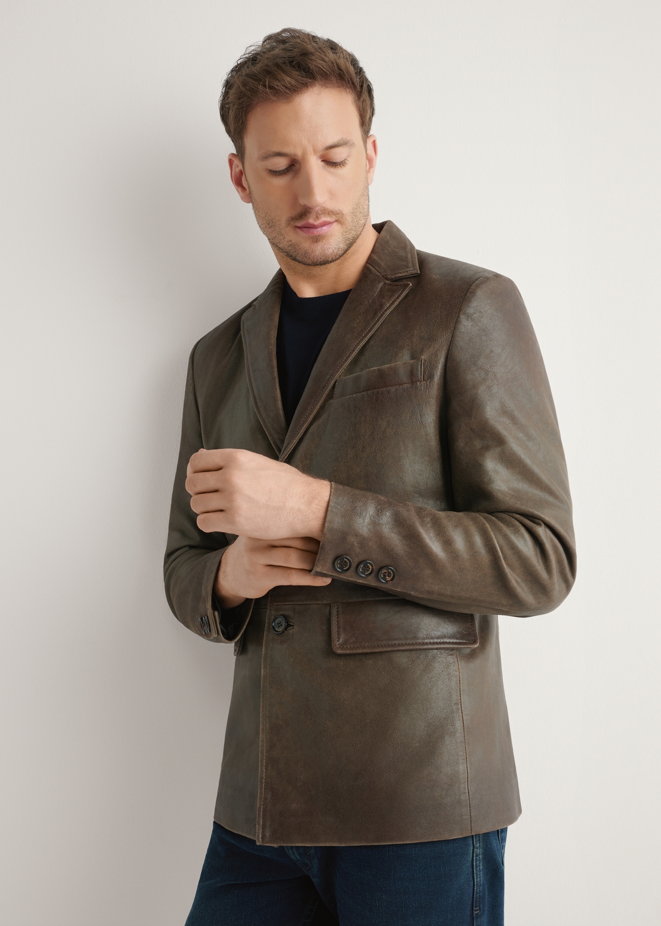 Men's brown leather jacket KURMS-0402-1H(W26) - front view of the product, on a model, against a light background. Half of the silhouette visible.