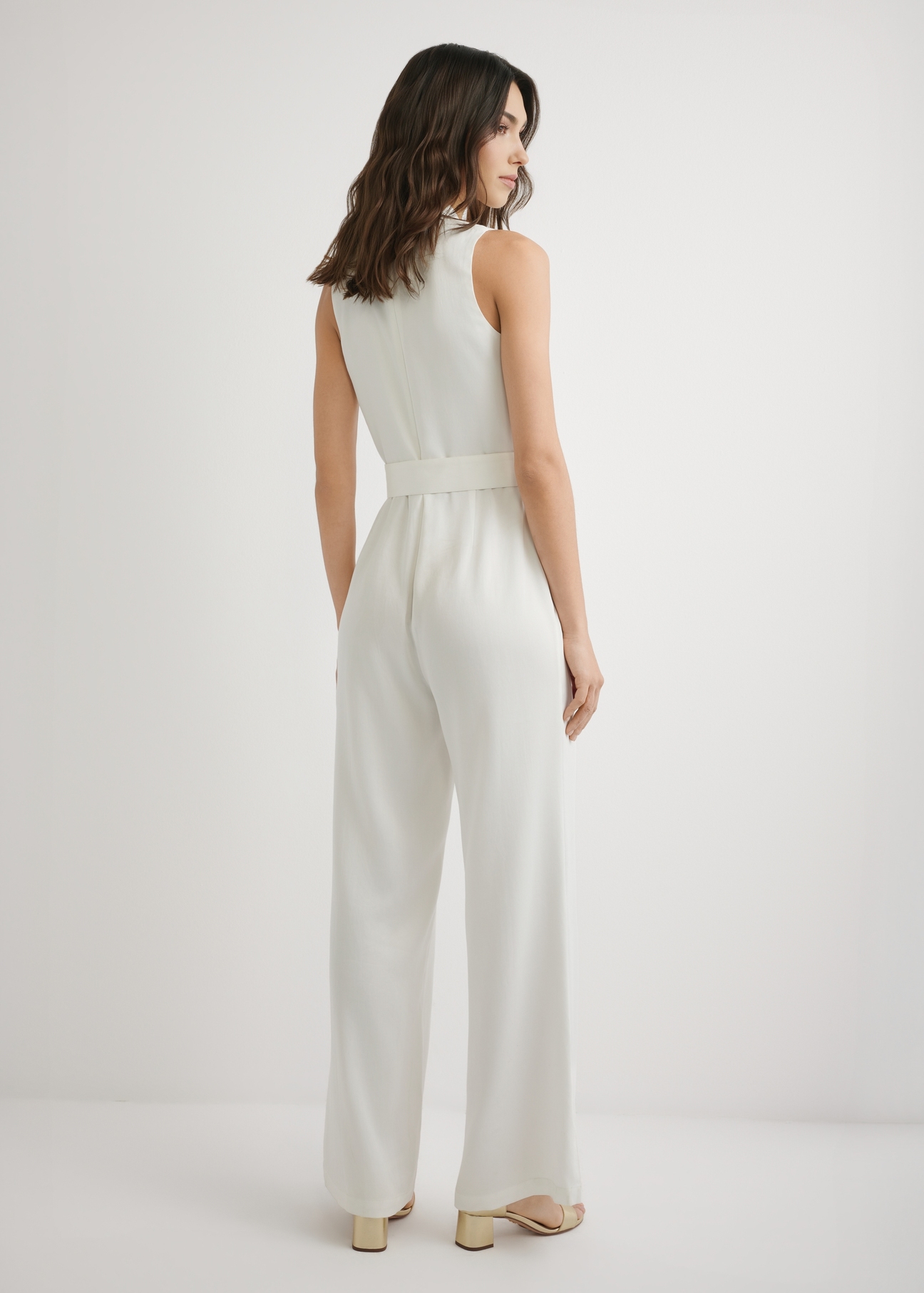 Cream women's jumpsuit KOBDT-0012-0B(W26), back view of the product on the model. Full body visible.