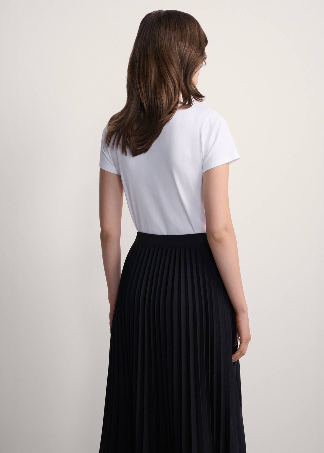 White women's basic T-shirt TSHDT-0111-0A(KS), back view of the product on the model. Half of the silhouette visible.