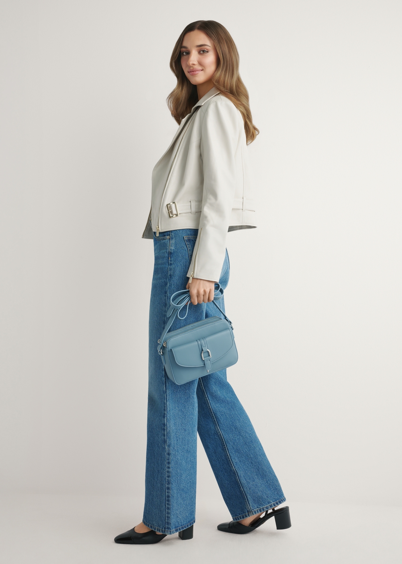 Blue small women's handbag TOREC-1175-7C(W26) - front view of the product, on a model, against a light background. The entire silhouette is visible.