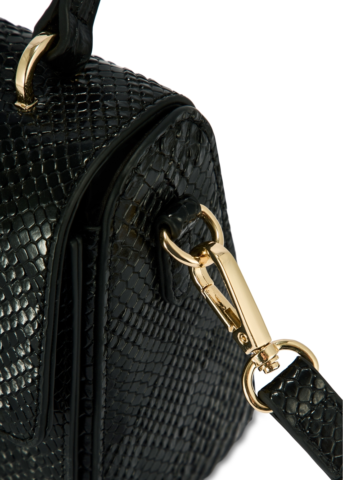 Black women's trunk handbag TOREC-1080-98(Z25), close-up of the product detail, view on a white background.