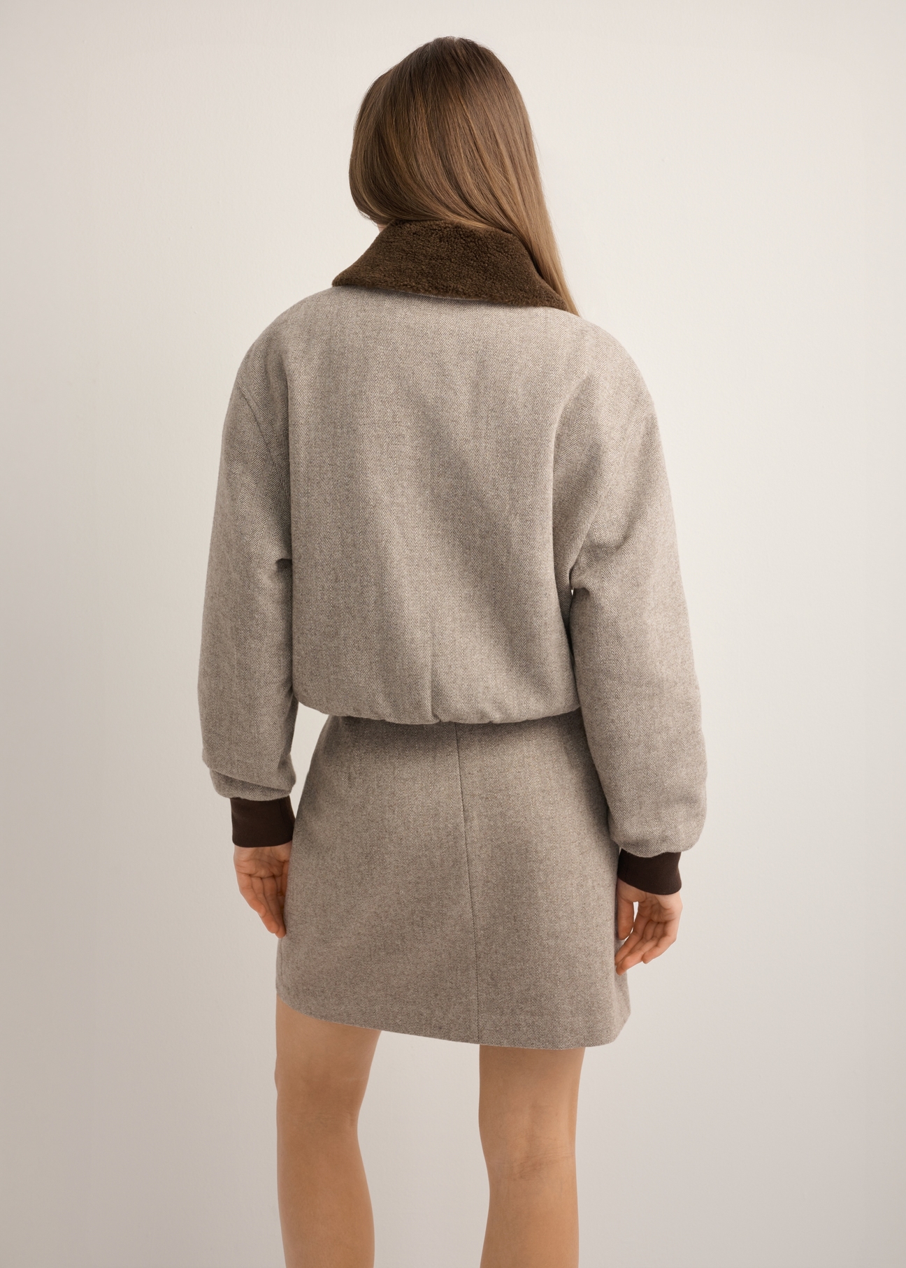 Women's short beige wool jacket PLADT-0077-1B(Z26), back view of the product on the model. Half of the silhouette visible.