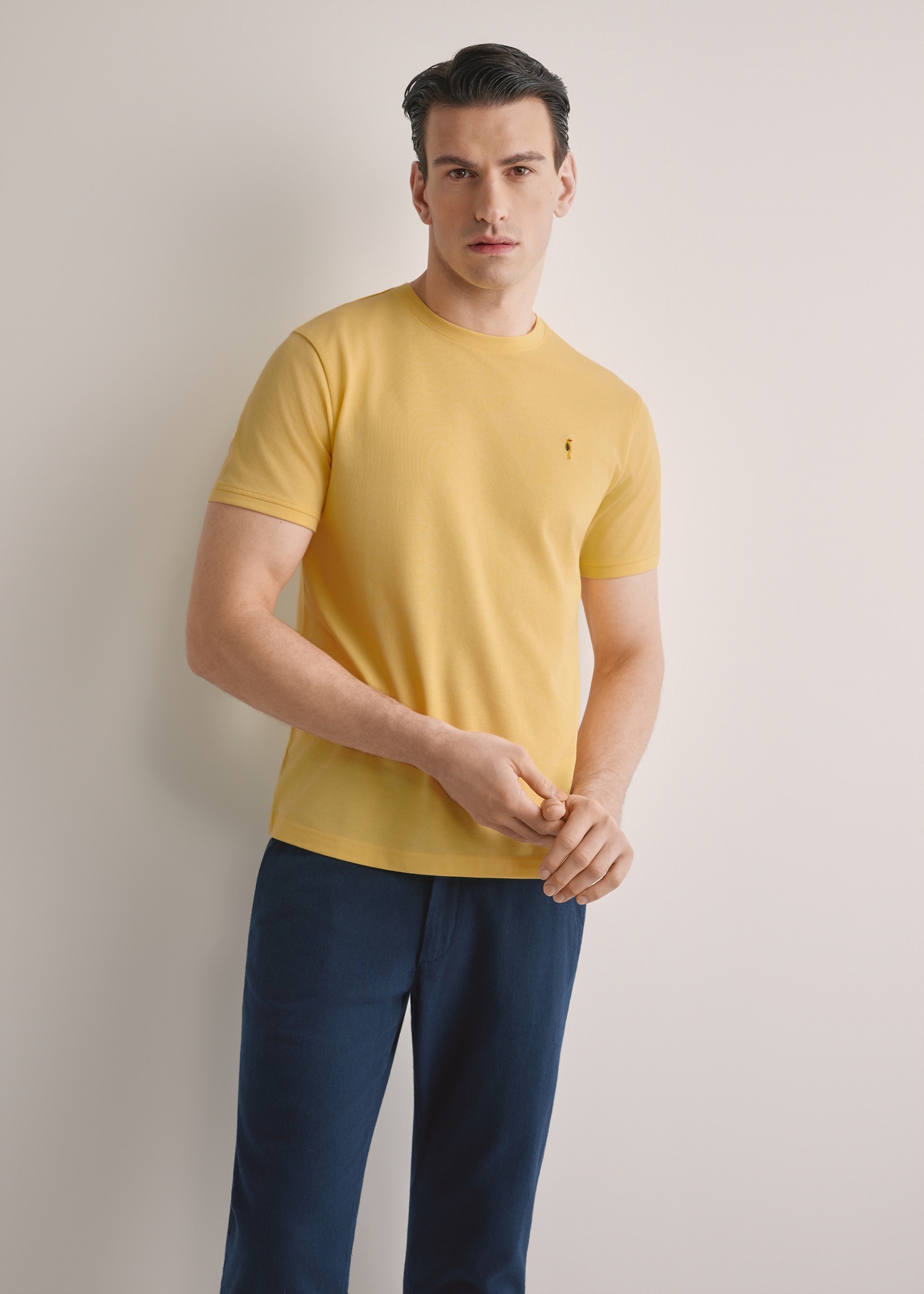 Men's yellow cotton t-shirt TSHMT-0136-2B(W26), front view of the product on the model. Half of the silhouette visible.