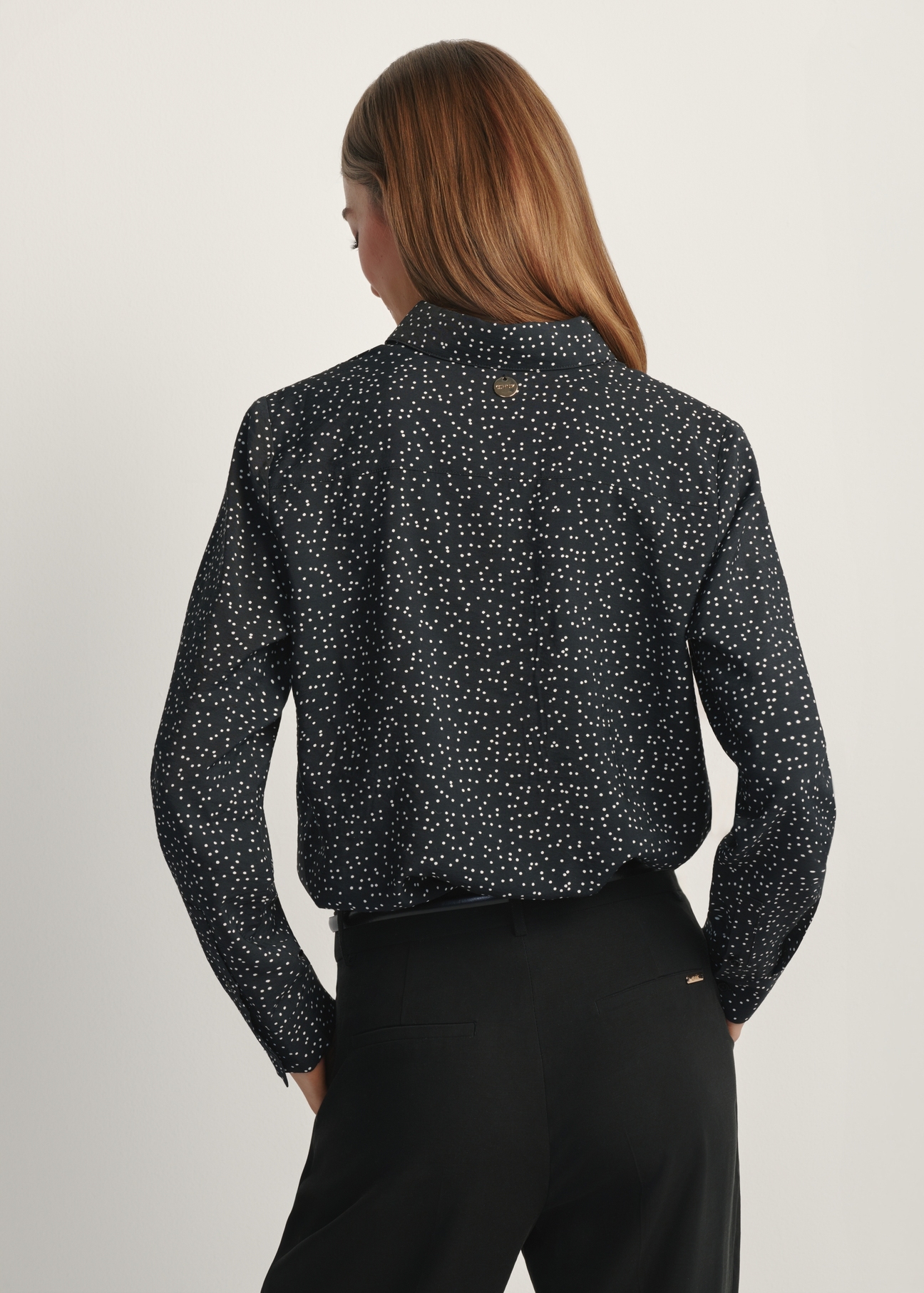 Women's black polka dot shirt KOSDT-0180-9P(W26), back view of the product on the model. Half of the silhouette visible.