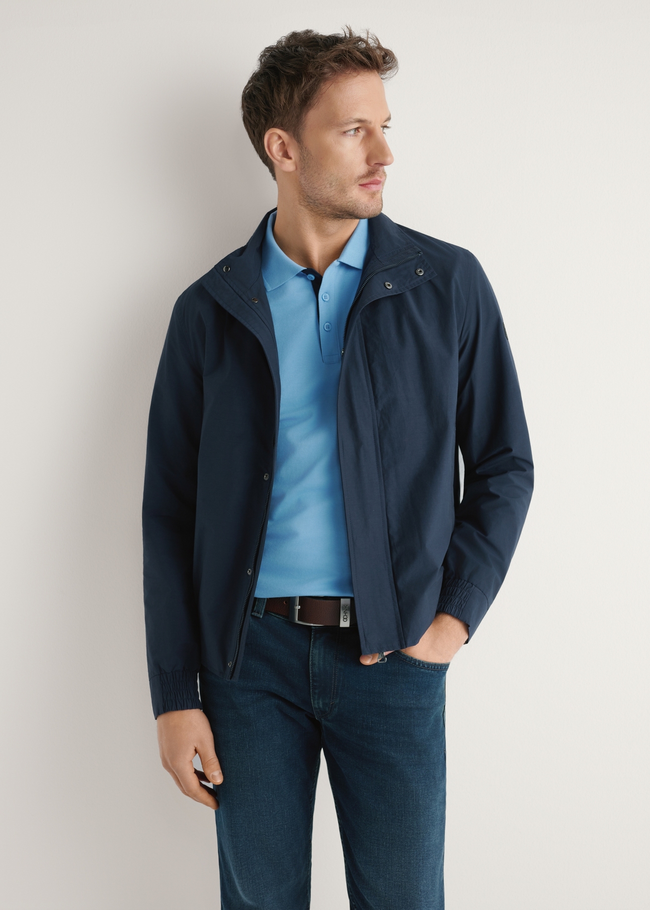 Men's navy blue transitional jacket KURMT-0417-7E(W26) - front product view, modeled, against a light background. Half-length silhouette visible.