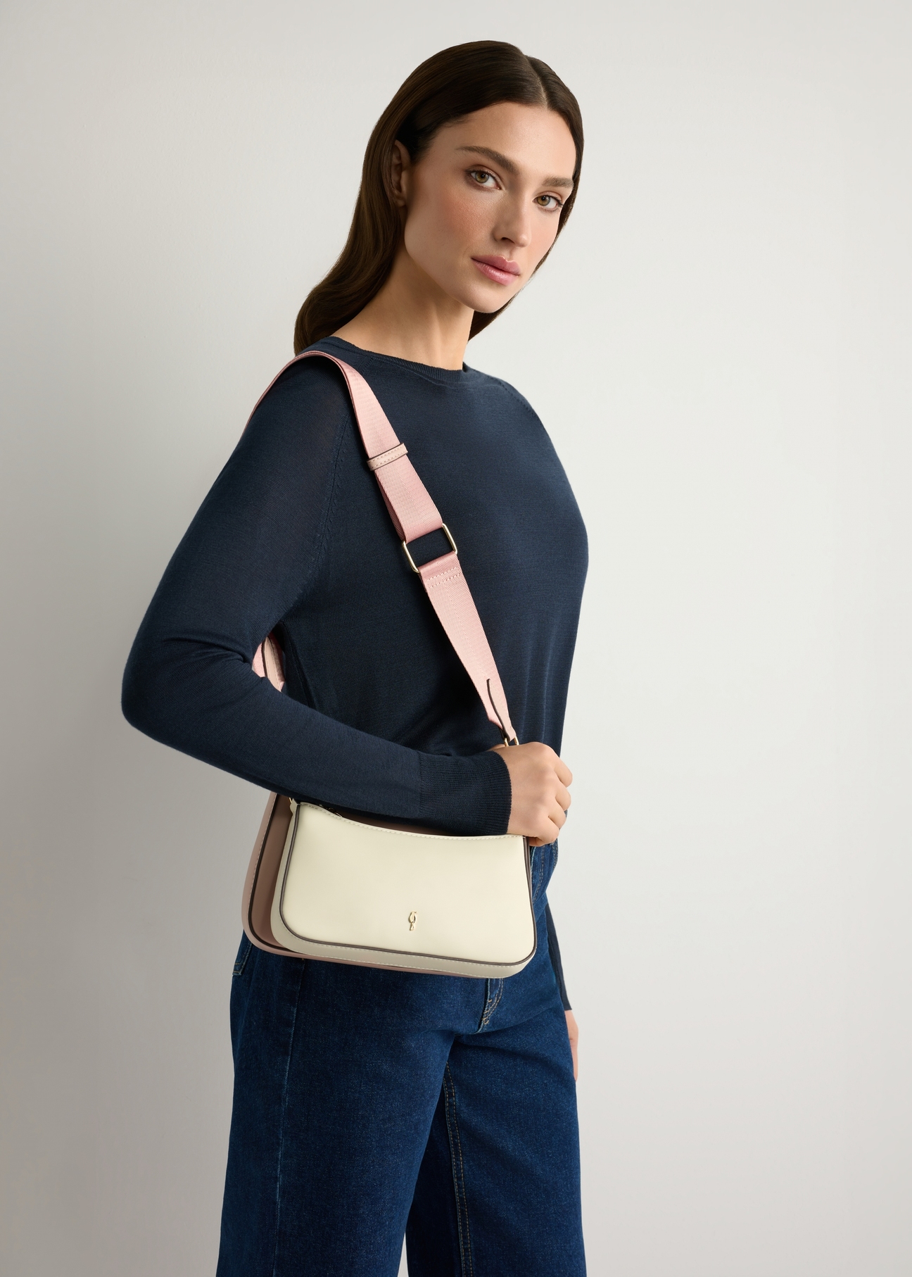 Two-piece women's handbag TOREC-1187-0P(W26), product view on model's shoulder. Half of silhouette visible.