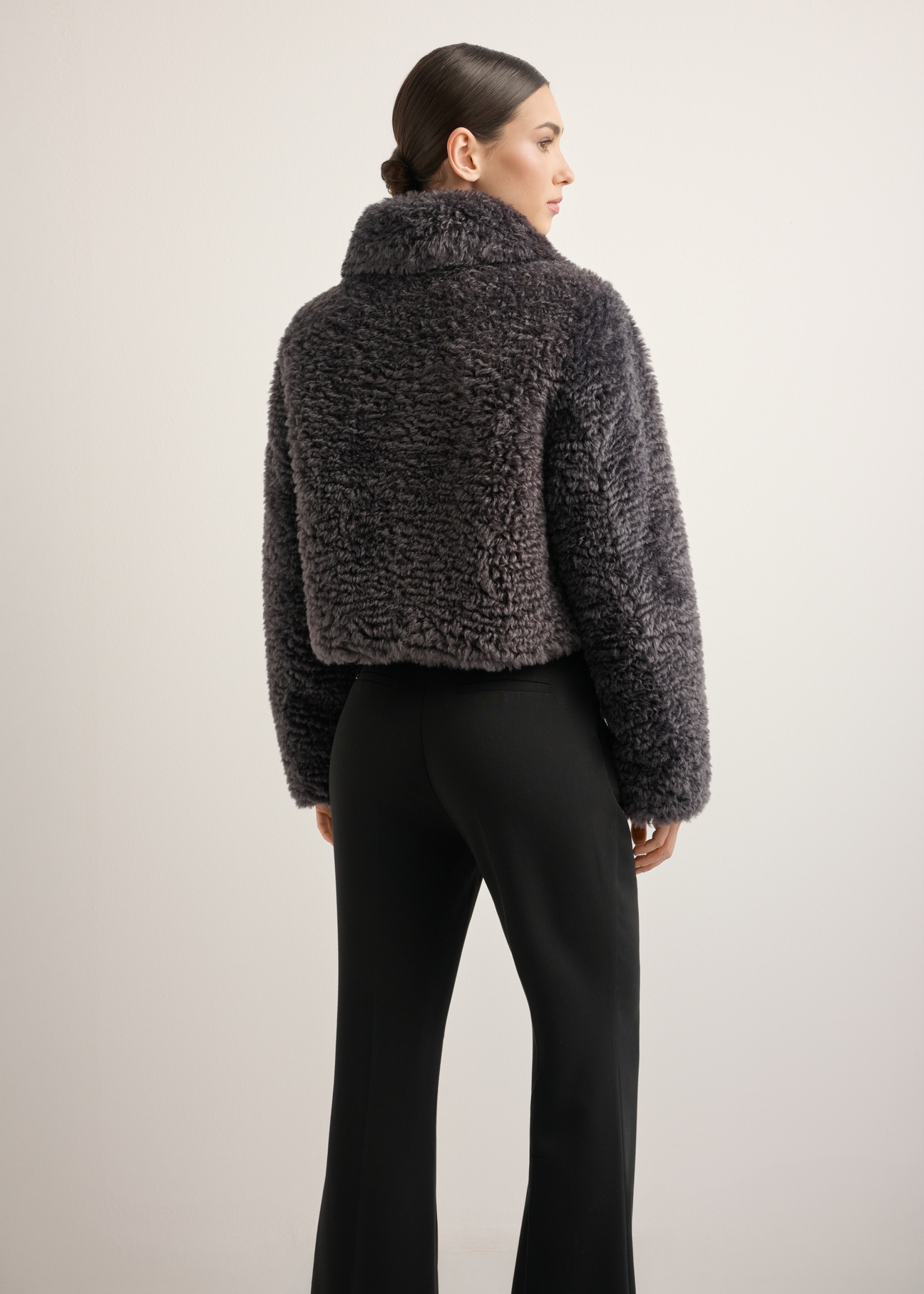 Women's gray short fur coat FUTDP-0082-9D(Z26), back view of the product on the model. Half of the silhouette visible.