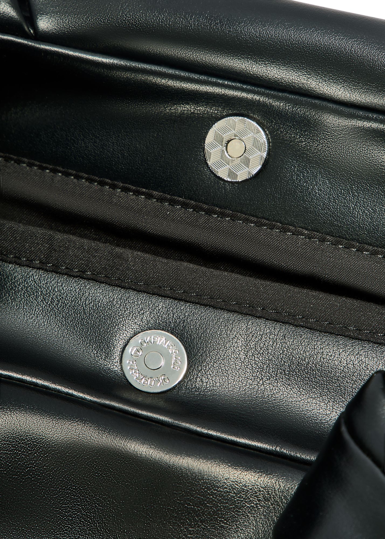 Black women's shoulder bag TOREC-1096-99(Z25) - close-up of the detail on a white background.
