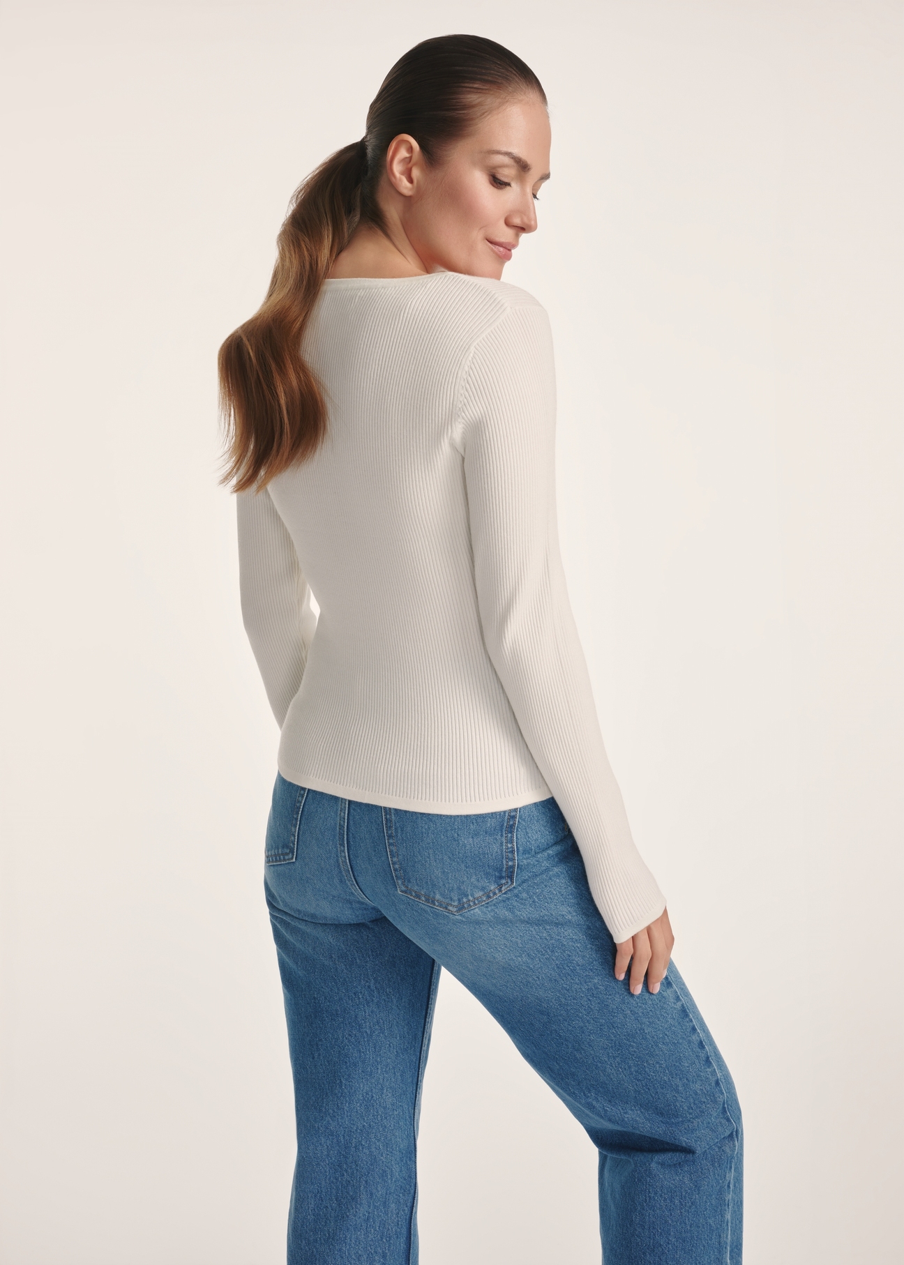White women's long sleeve blouse LSLDT-0051-12(Z25), product view from the back on the model. Half of the silhouette visible.