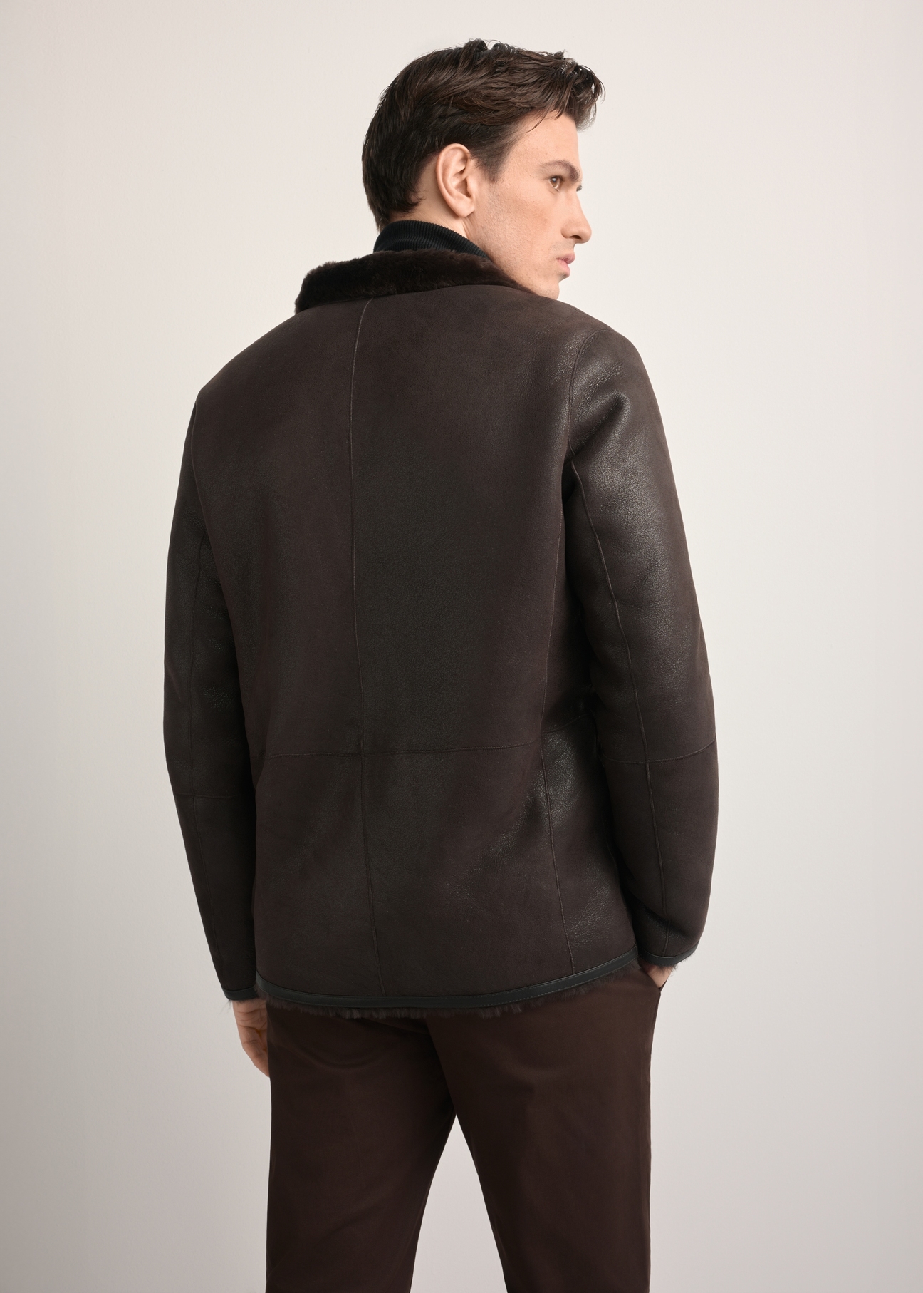 Men's brown leather sheepskin coat KOZMS-0025-3190(Z25), back view of the product on the model. Half of the silhouette visible.