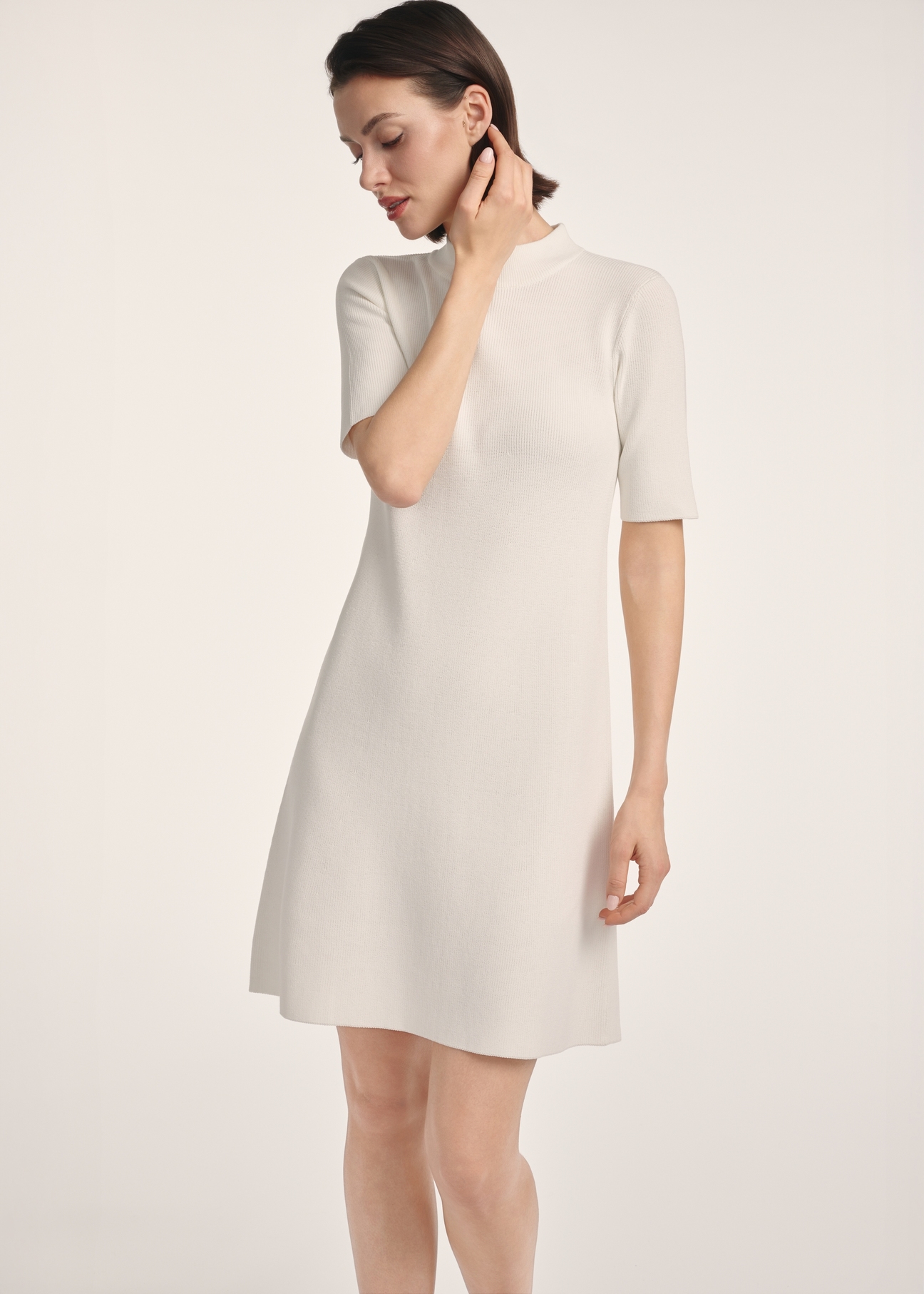 Cream women's dress SUKDT-0243-12(Z25), product visible from the front on the model, half of the silhouette visible.