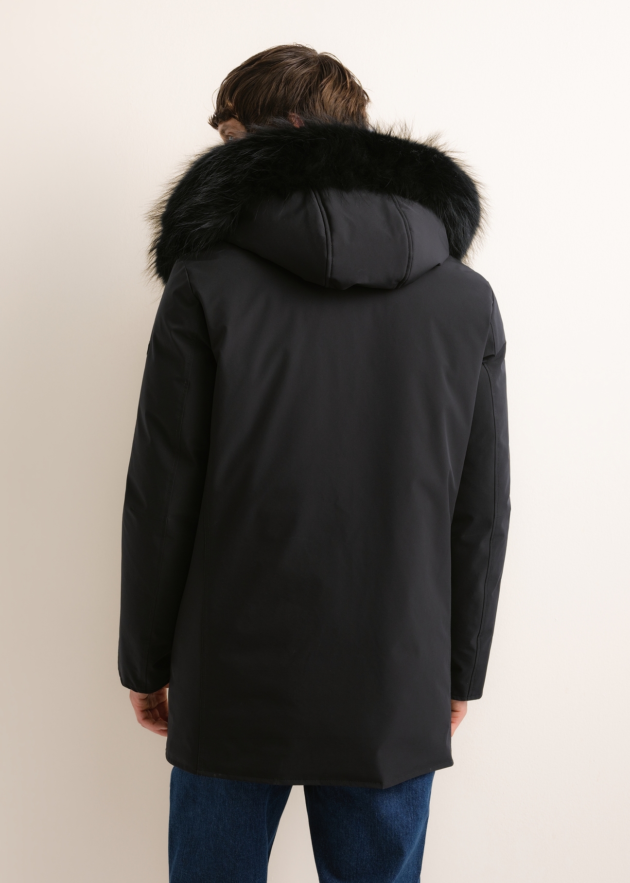 Men's black winter jacket KURMT-0446-99(Z26), rear view on a model. Half of the figure is visible.