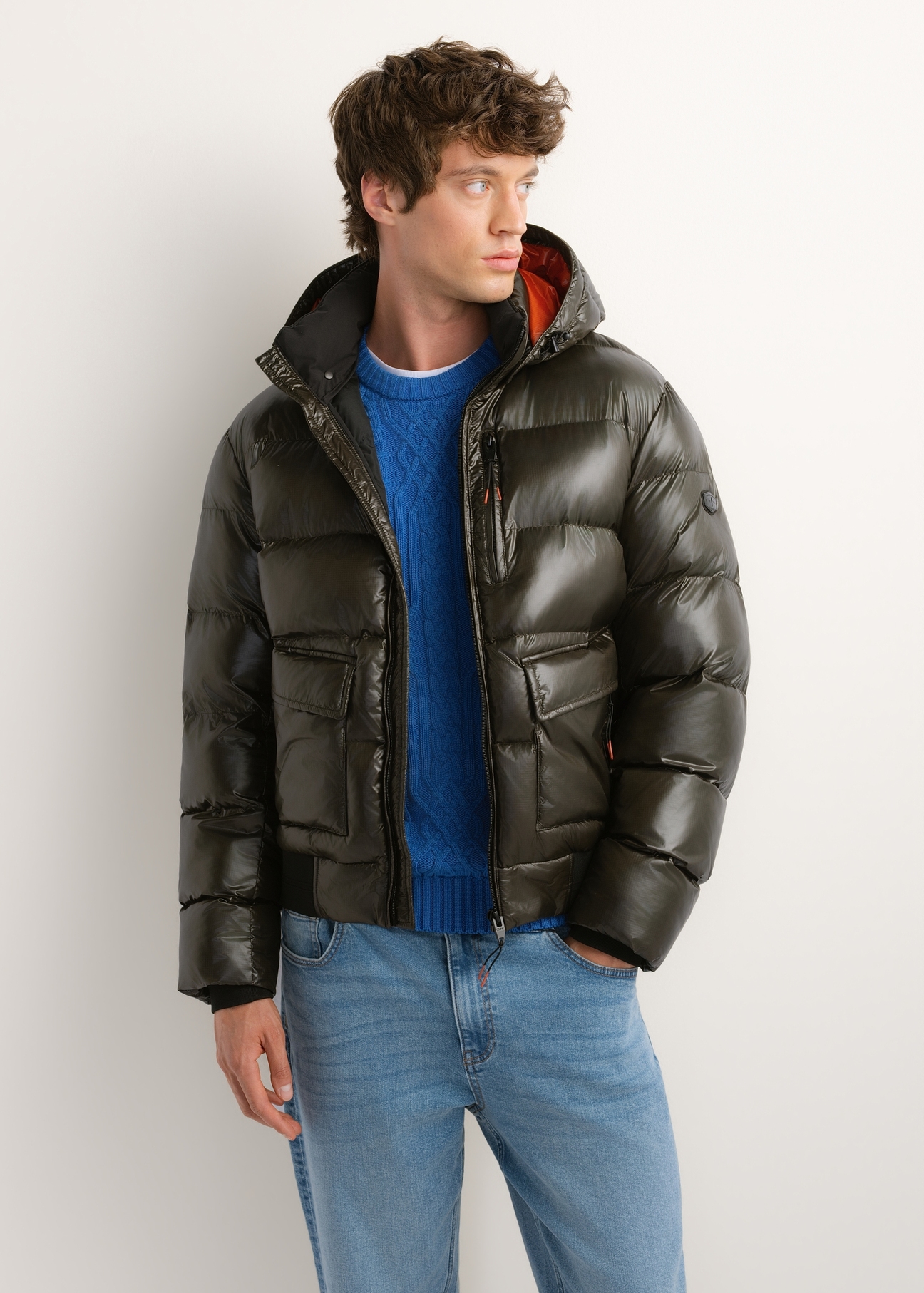 Men's green nylon jacket KURMT-0448-8B(Z26), front product view on model. Half silhouette visible.