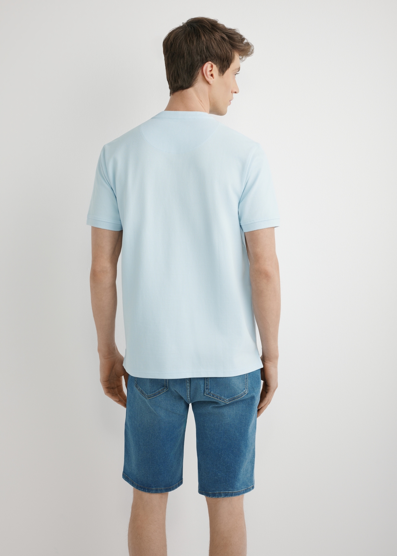 Light blue men's polo shirt POLMT-0095-7A(W26), back view of the product on the model. Half of the silhouette visible.