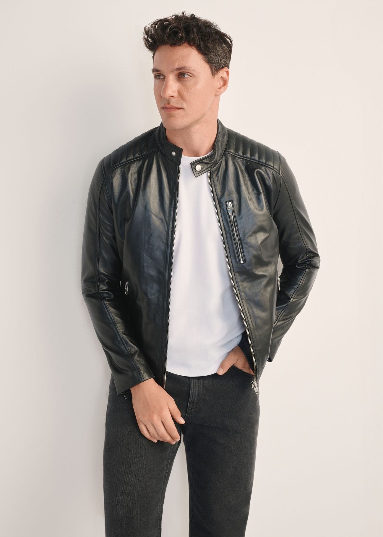 Men's leather jacket with stand-up collar KURMS-0191A-5491(KS), front view of the product on the model, half of the silhouette visible.