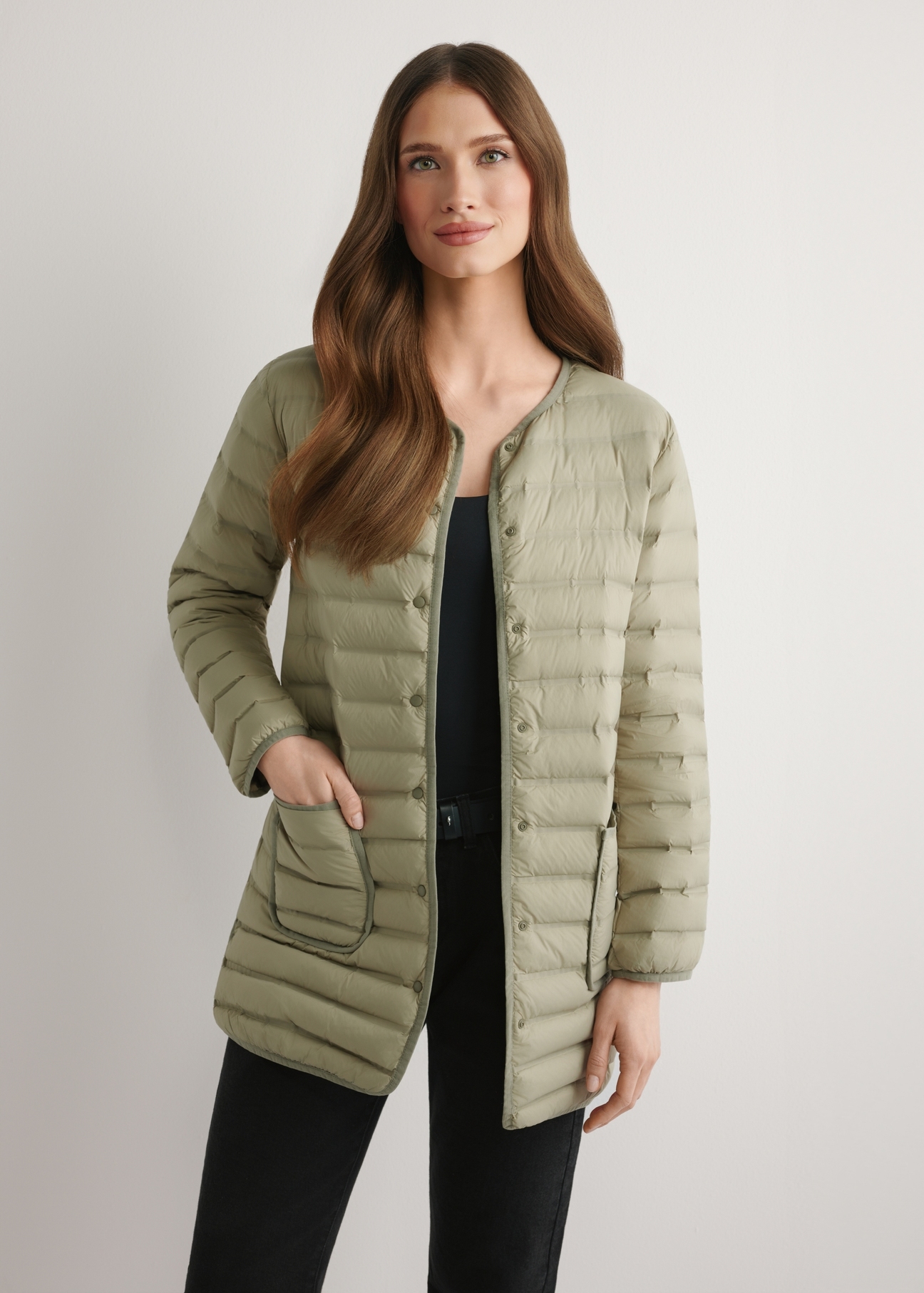 Women's olive green jacket with natural insulation KURDT-0636-8E(W26) - front view of the product, on a model, against a light background. Half-length silhouette visible.