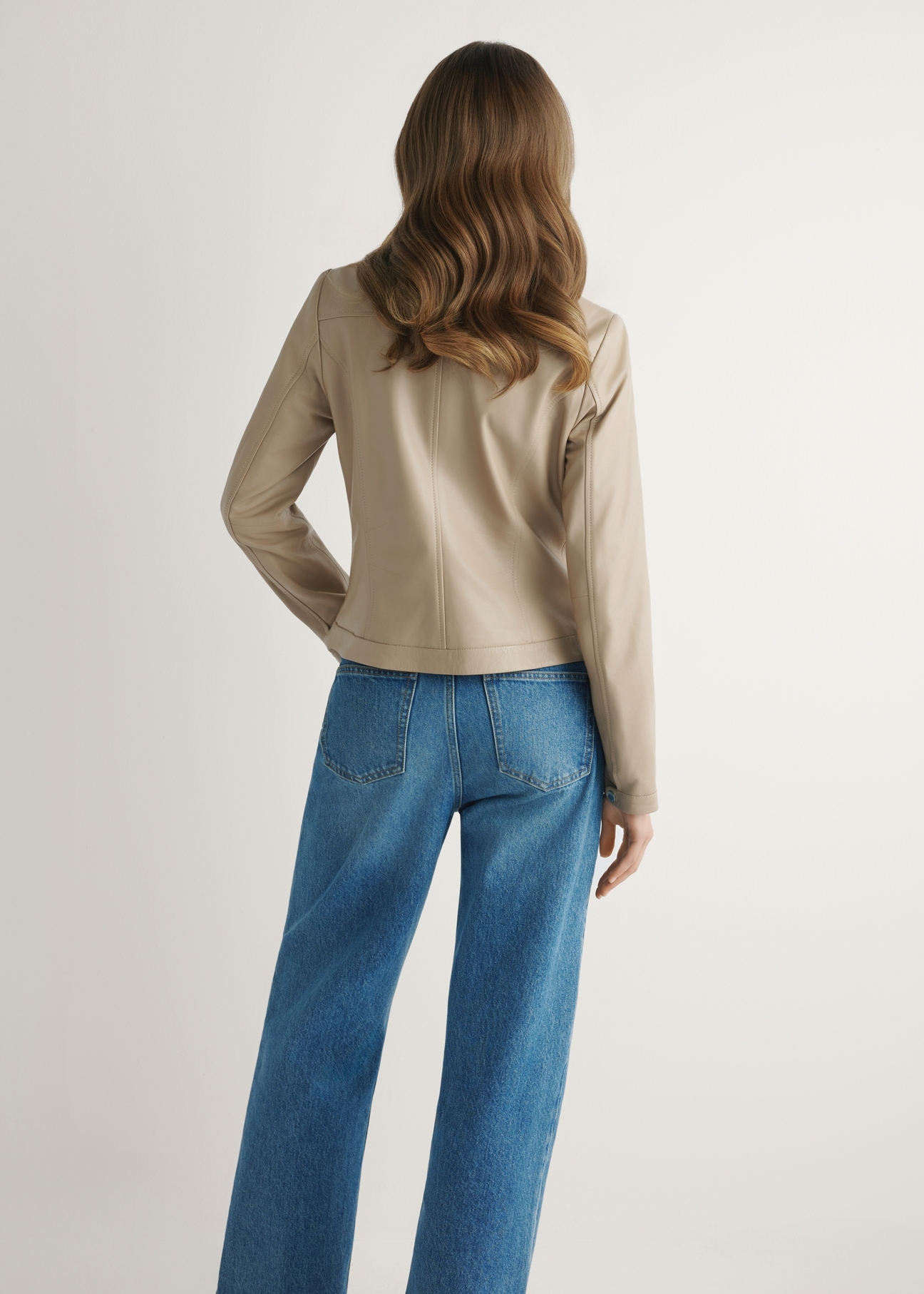 Beige women's genuine leather jacket KURDS-0154-1B(W26), back view of the product on the model. Half of the silhouette visible.