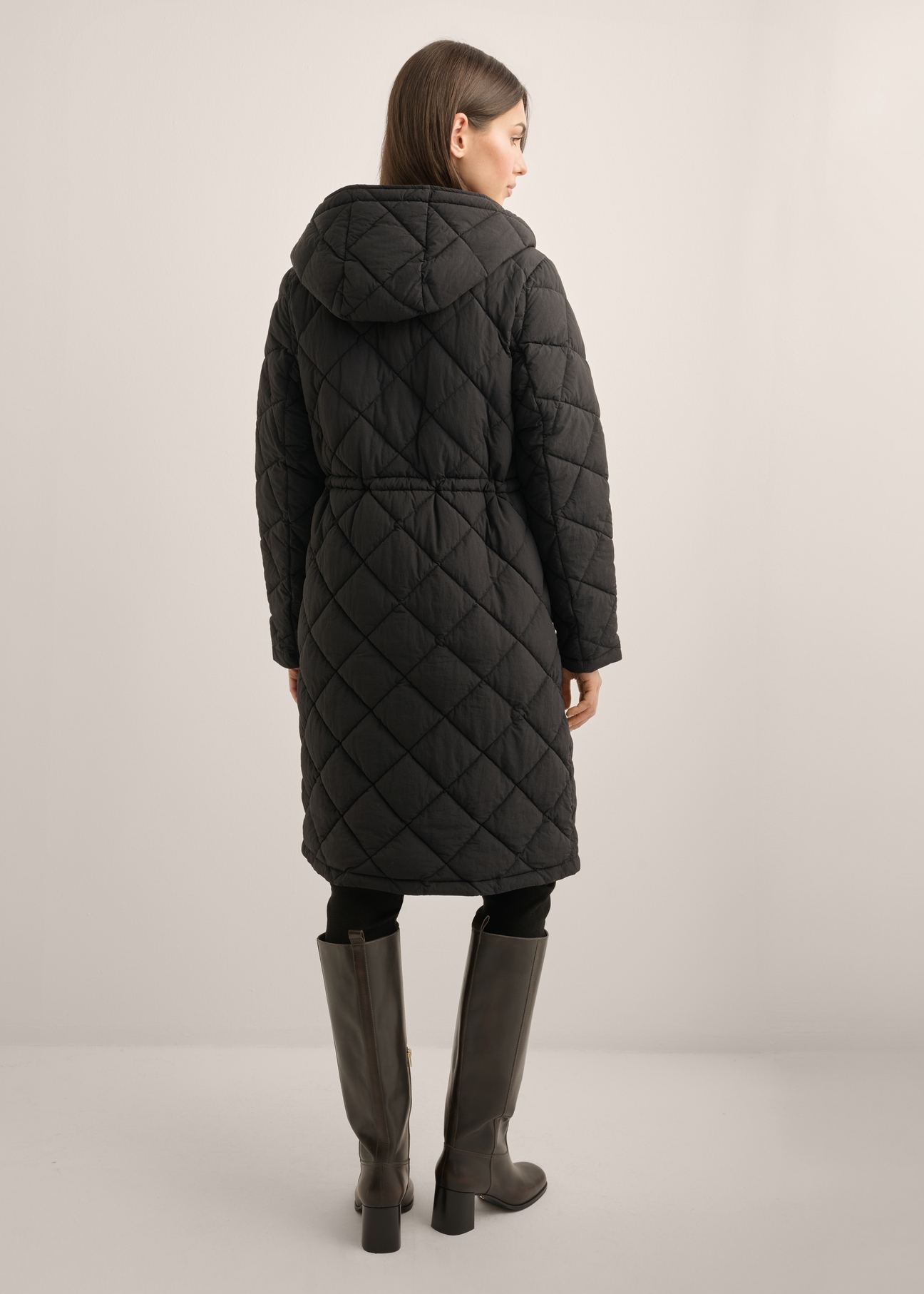 Women's black quilted jacket KURDT-0667-99(Z26), product view from the back on a model. Full body visible.