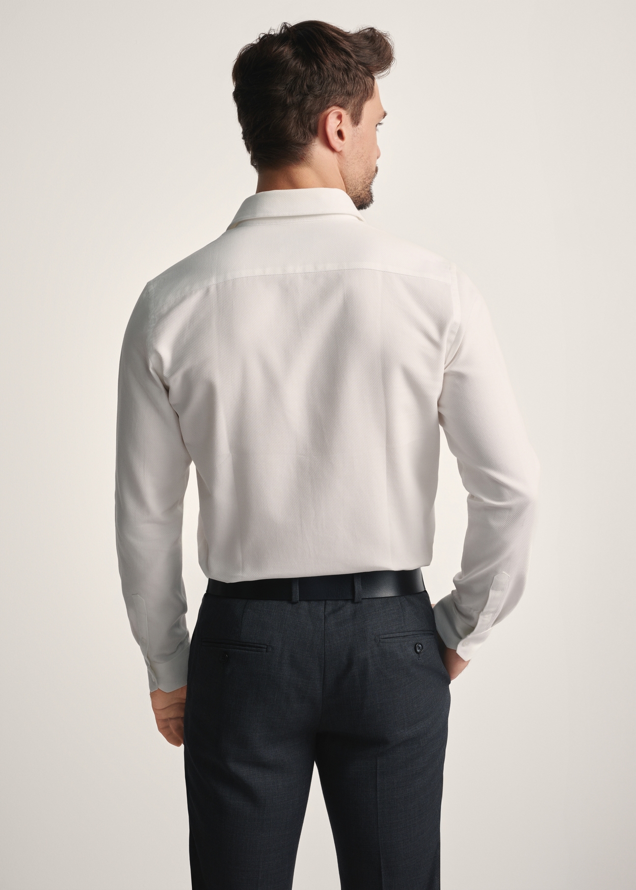 White men's shirt KOSMT-0334-12(Z25), back view of the product on the model. Half of the silhouette visible.