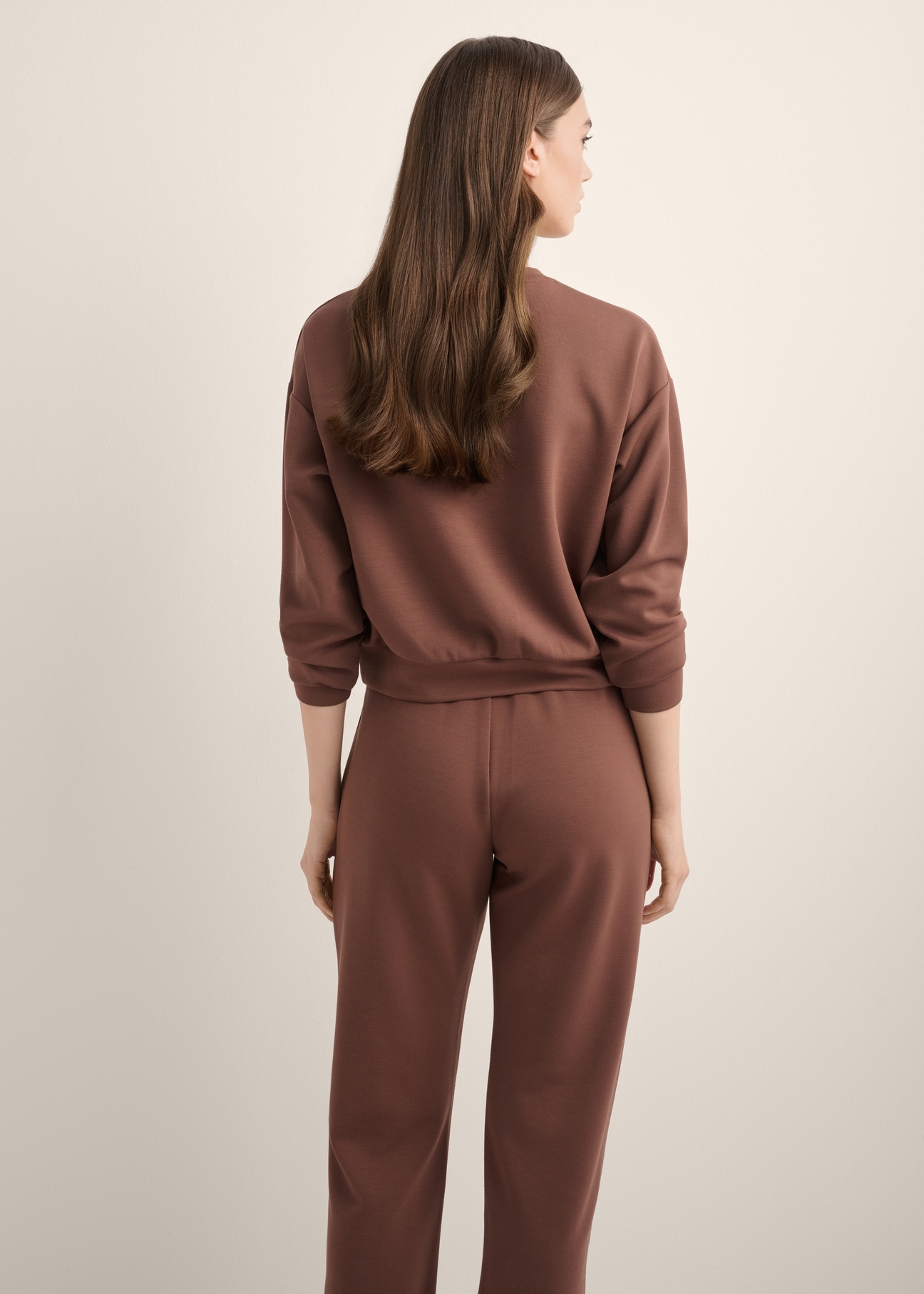 Brown women's sweatshirt BLZDT-0119-1H(Z26), back view of the product on the model. Half of the silhouette visible.