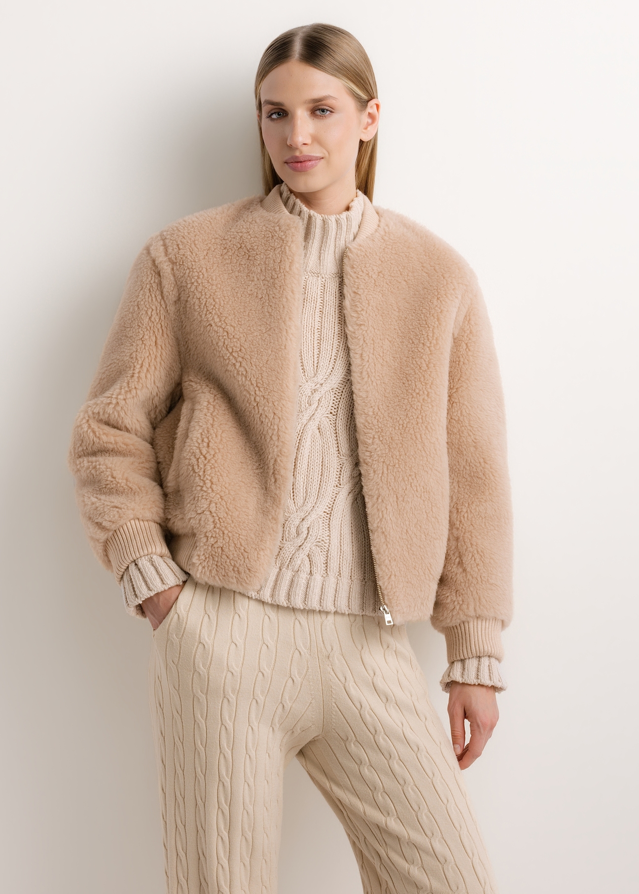 Beige short women's wool fur coat FUTDW-0045-1B(Z26), front view of the product on the model. Half of the silhouette visible.