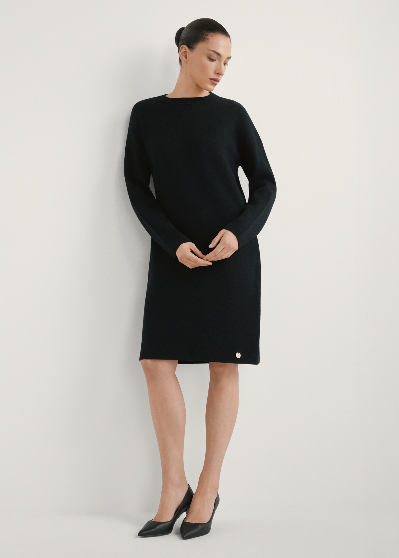 Black women's dress SUKDT-0260-99(W26), product view from the front, the model's entire silhouette is visible.