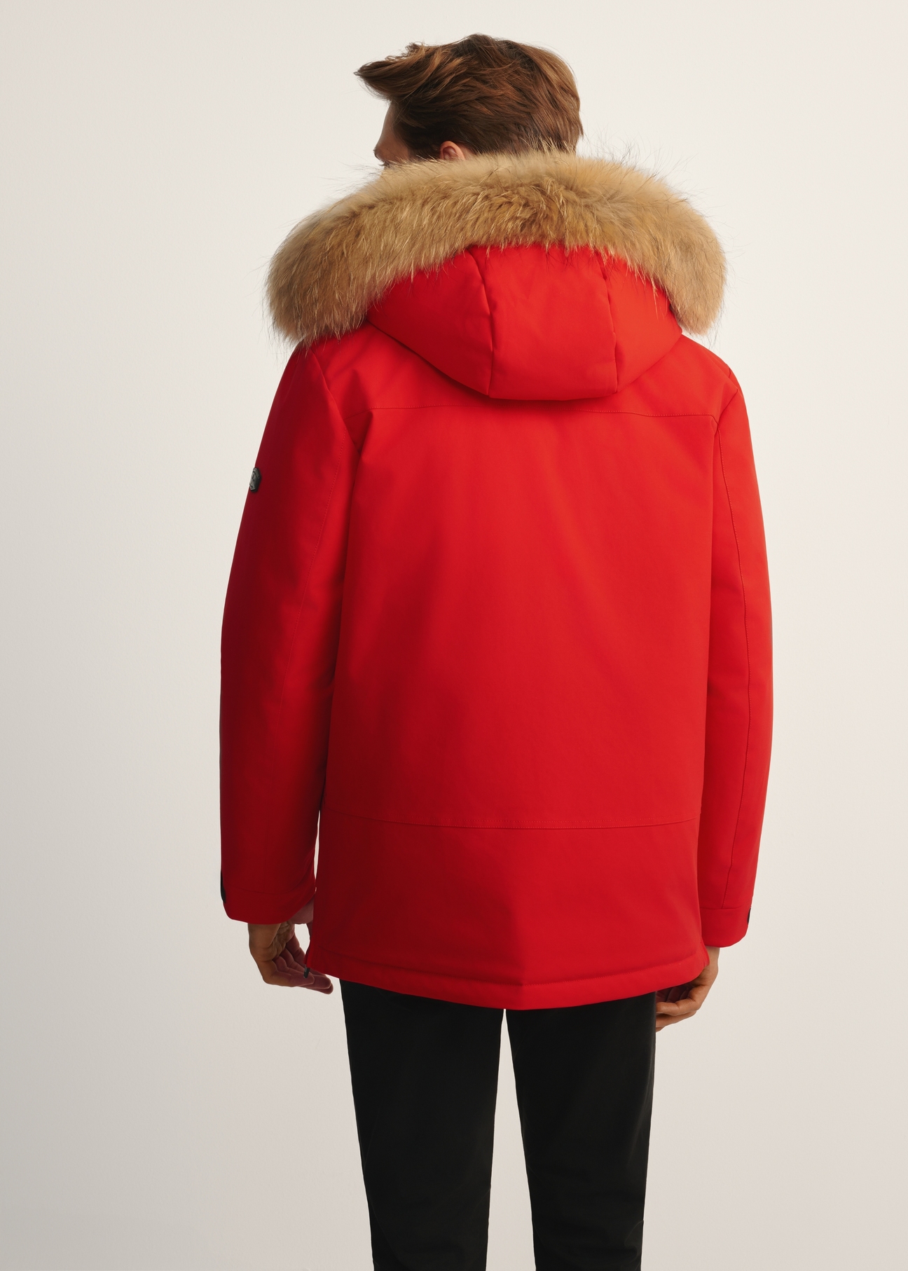 Red men's winter jacket KURMT-0396-42(Z25) - rear view of the product on the model, against a white background. Knee-length silhouette visible.