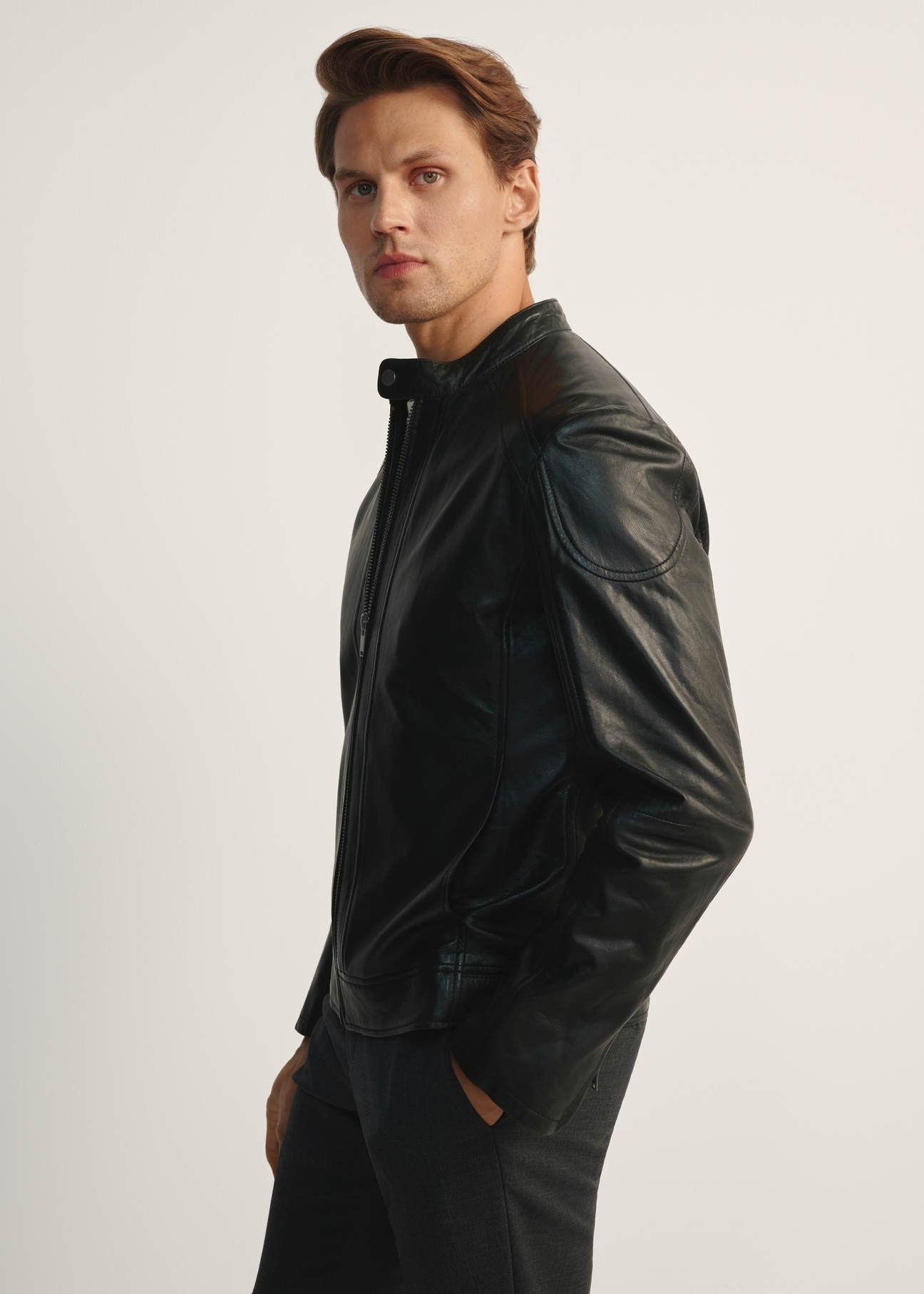 Men's black leather jacket with stand-up collar KURMS-0315-5427(Z25), product view from the side on a white background.