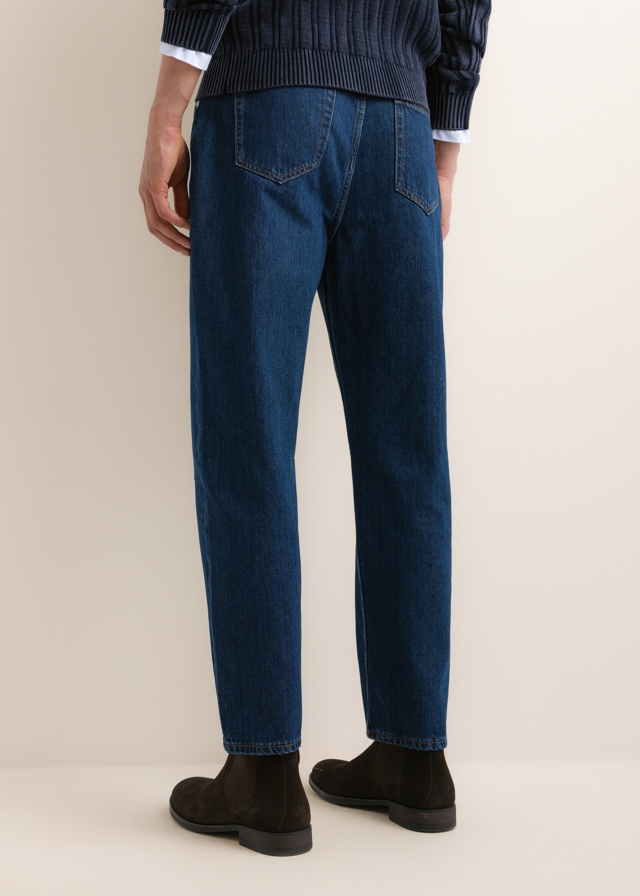 Blue men's denim pants JEAMT-0026-7C(Z26), back view of the product on the model. Half of the silhouette visible.