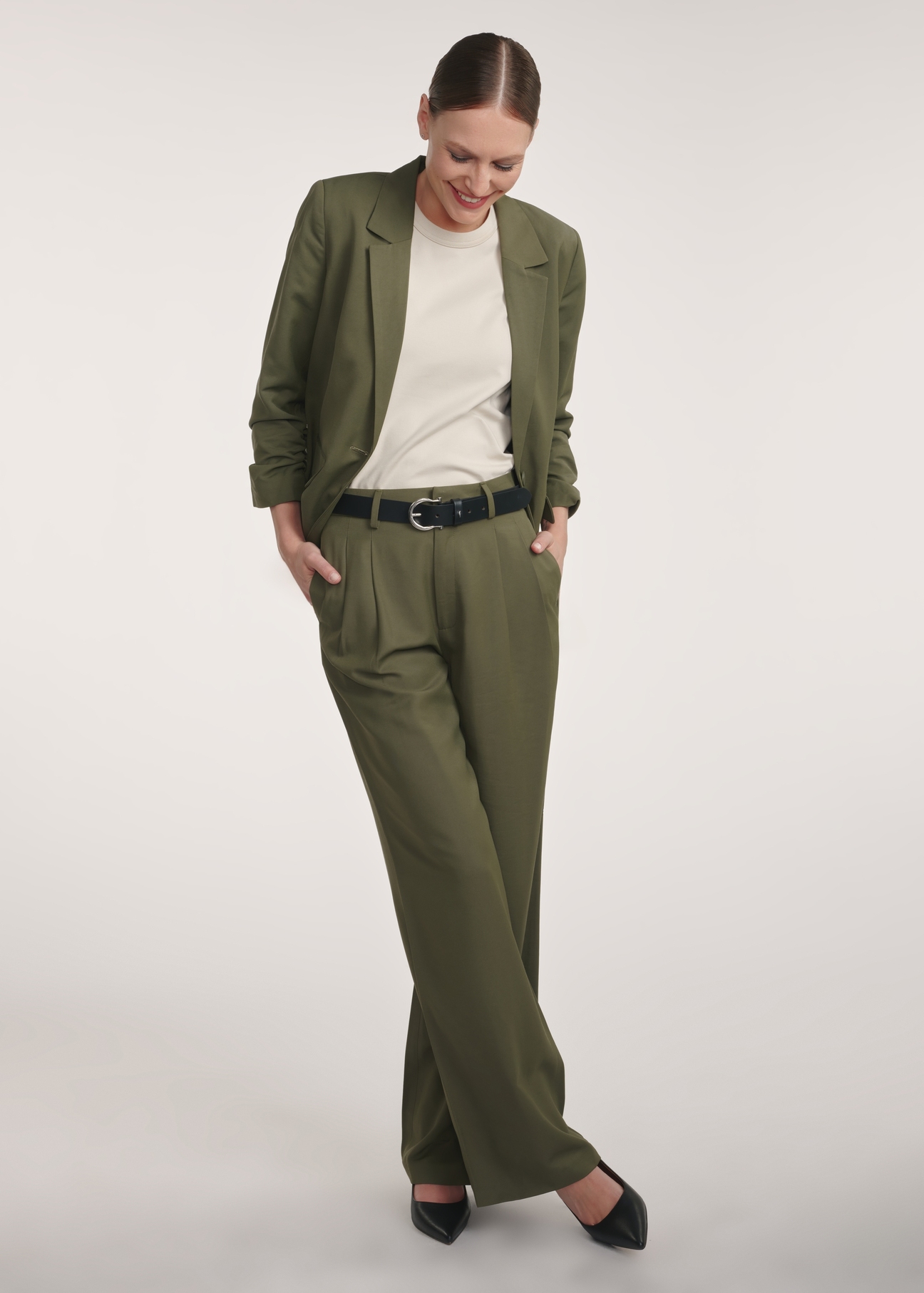 Women's khaki trousers SPODT-0112-55(Z25), front view of the product on the model, the entire silhouette is visible.