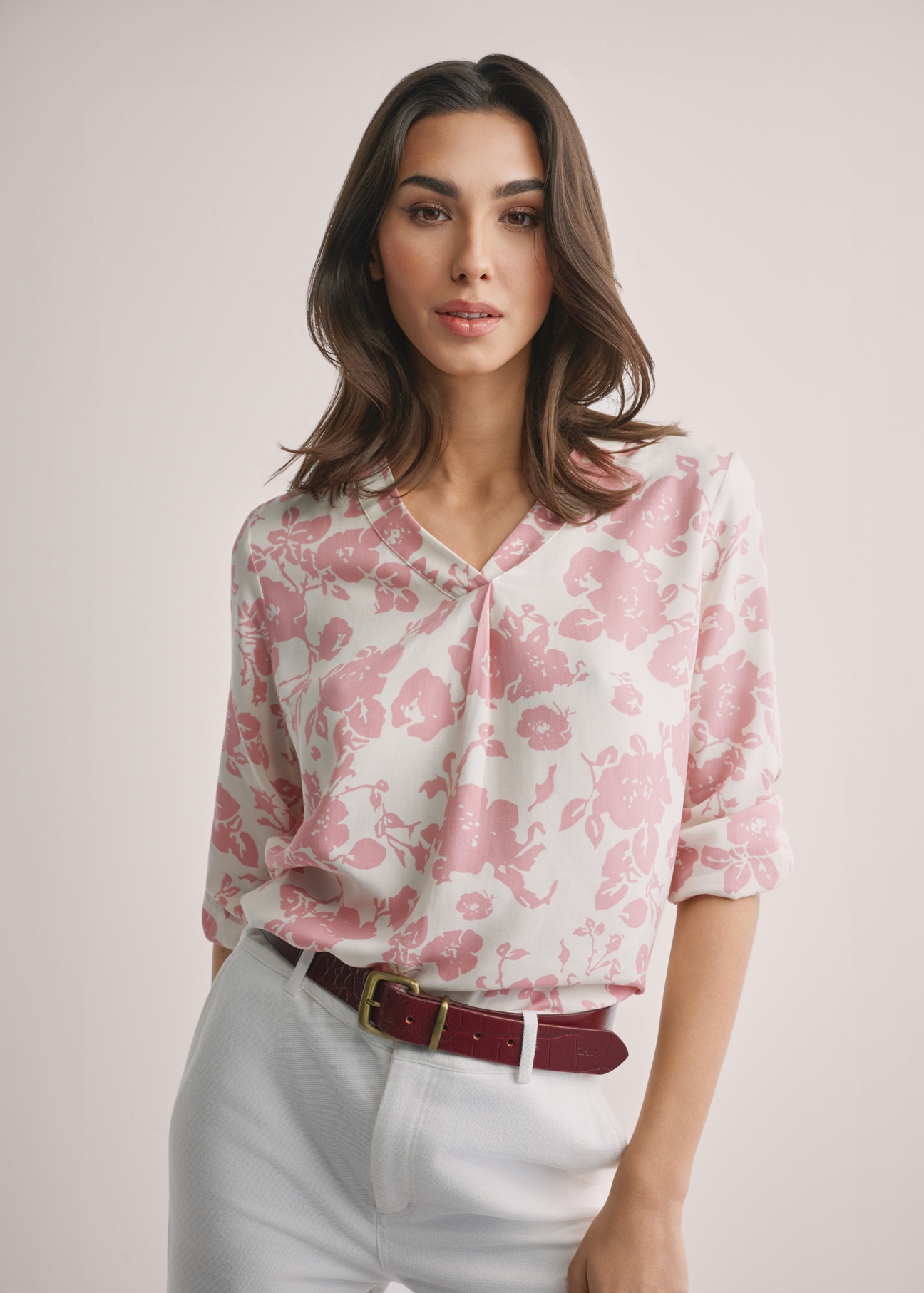 Women's pink floral blouse BLUDT-0172A-5P(W26), front view of the product on the model. Half of the silhouette visible.
