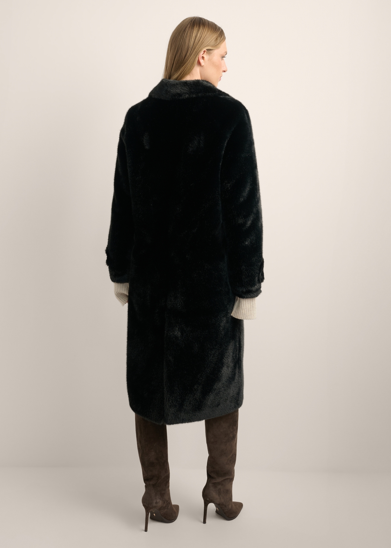 Women's long black fur coat FUTDP-0080-99(Z26), back view of the product on the model. Full body visible.