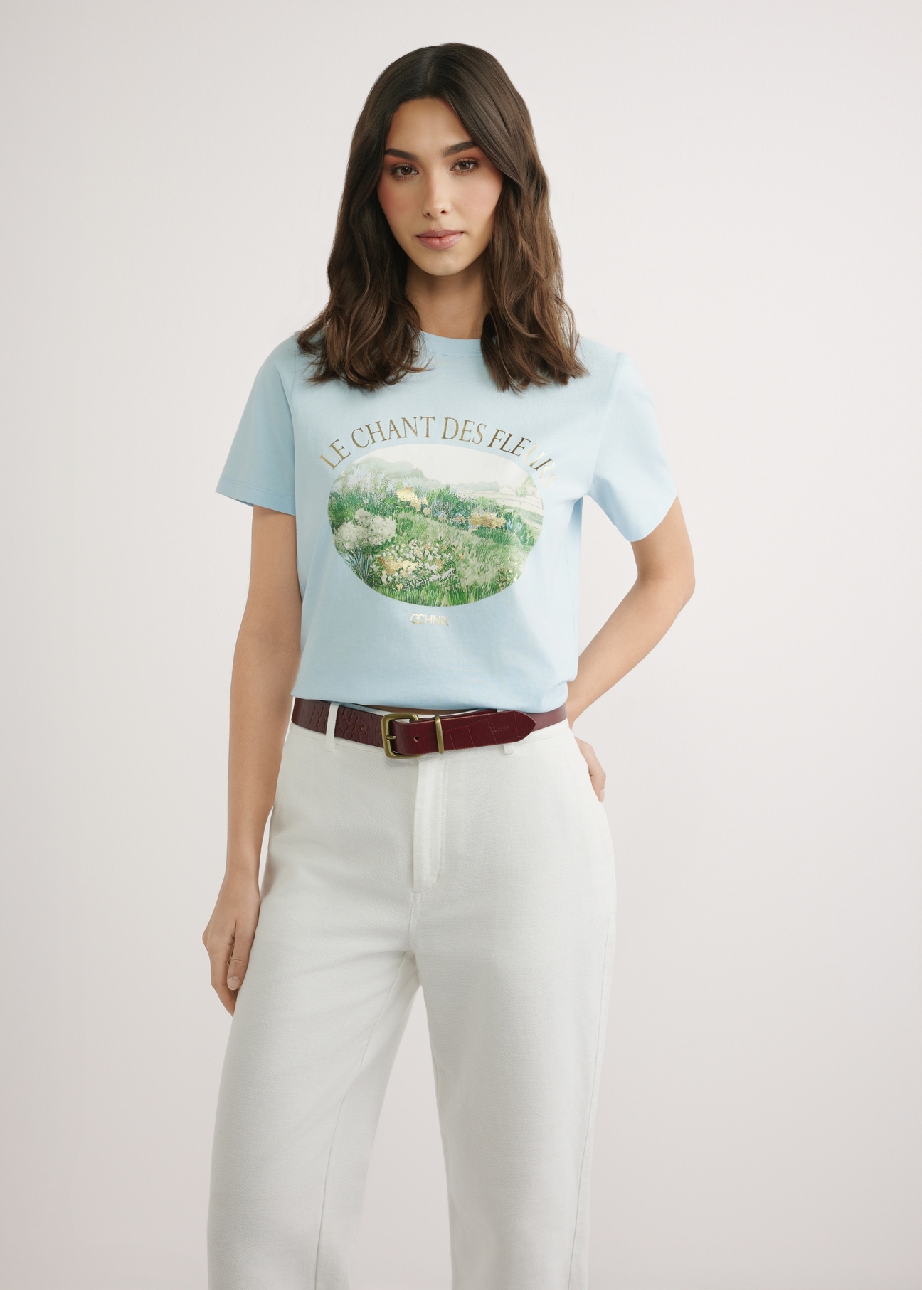 Blue women's t-shirt with print TSHDT-0159-7A(W26), front view of the product on the model. Half of the silhouette visible.