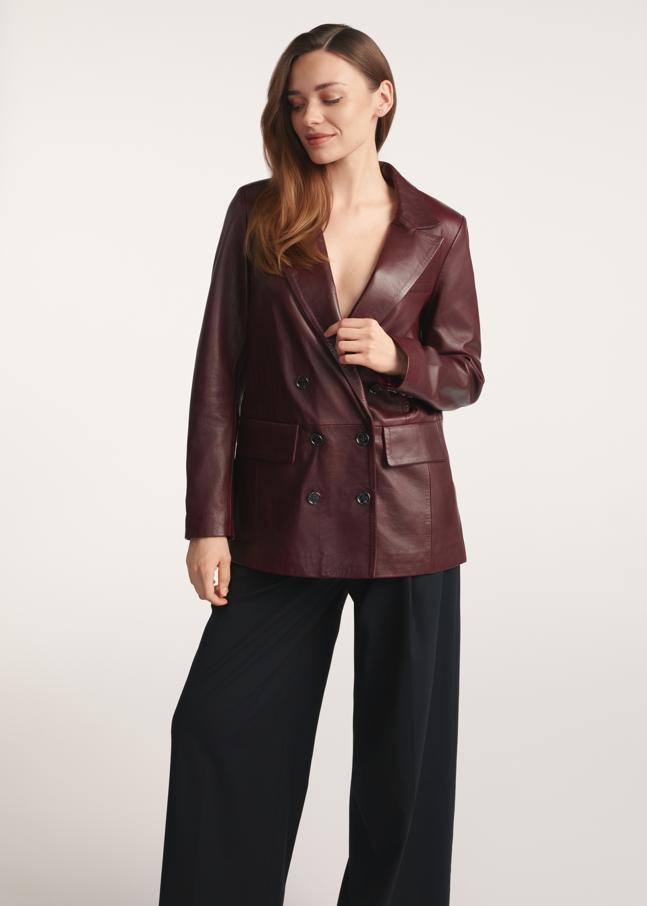 Burgundy women's leather jacket KURDS-0556-2869(Z25), front view of the product on the model, part of the silhouette visible.