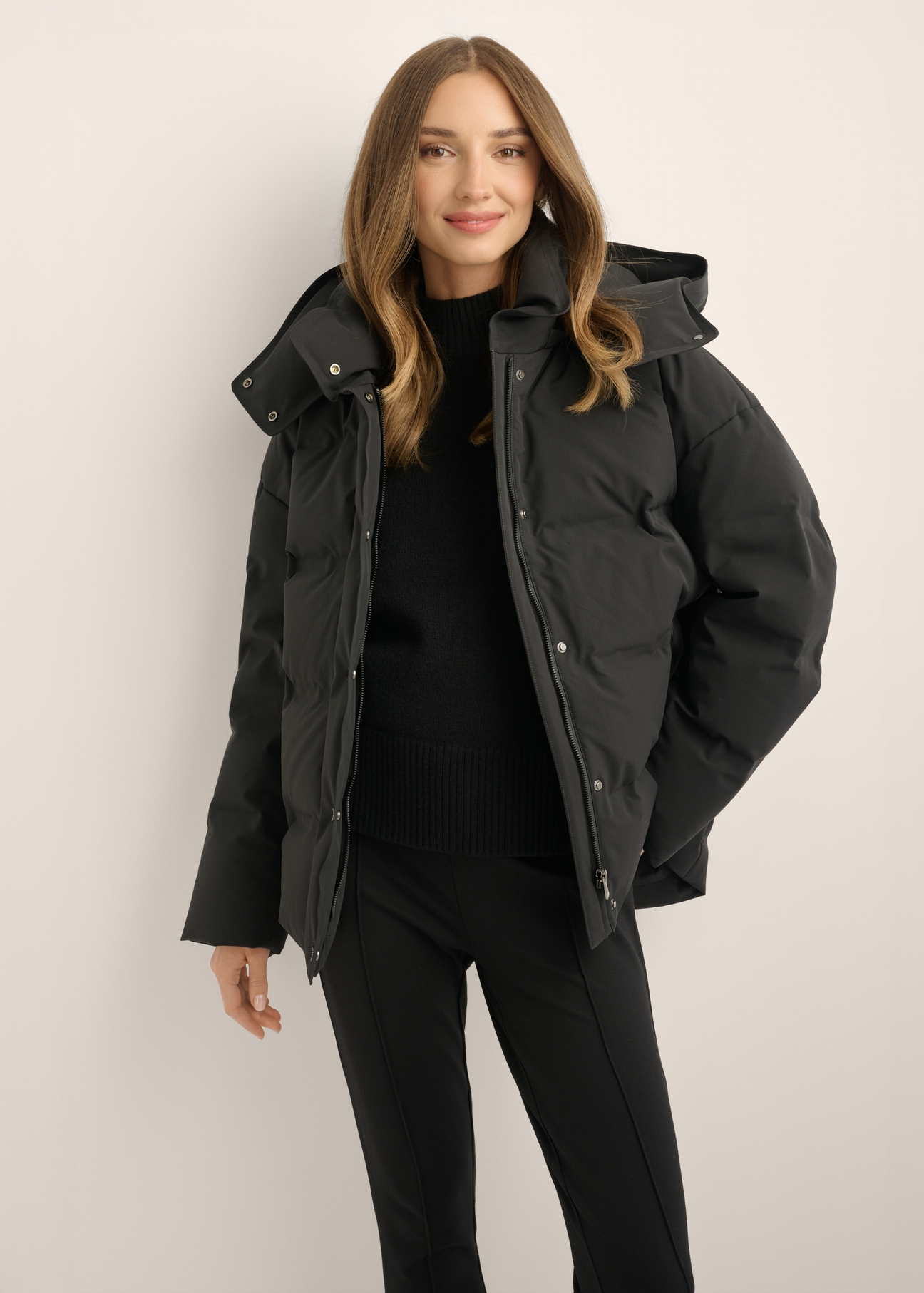 Women's jacket with natural fill KURDT-0702-99(Z26), front view of the product on the model. Half of the silhouette visible.