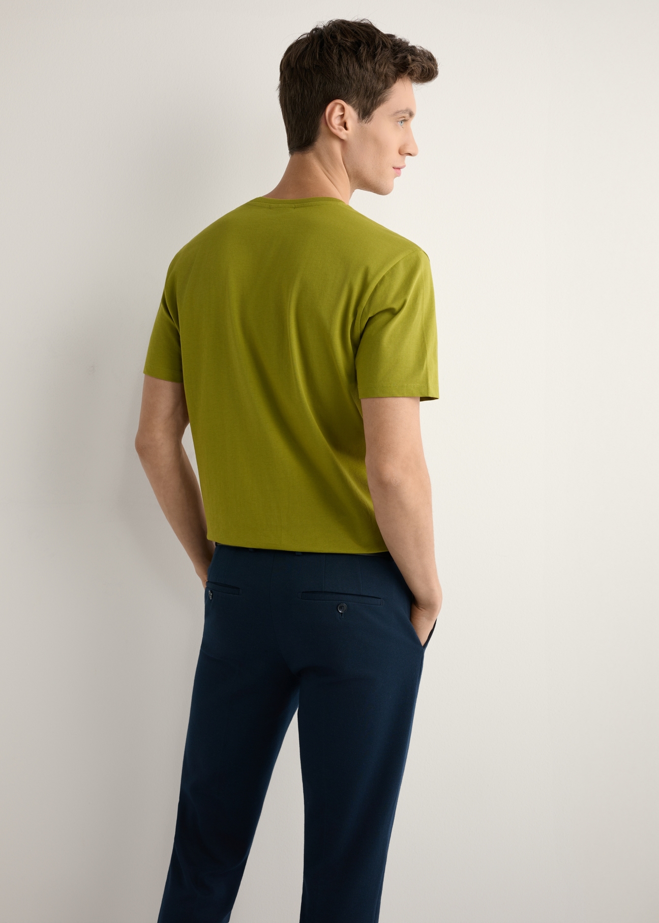 Men's olive T-shirt TSHMT-0120-8E(W26), back view of the product on the model. Half of the silhouette visible.