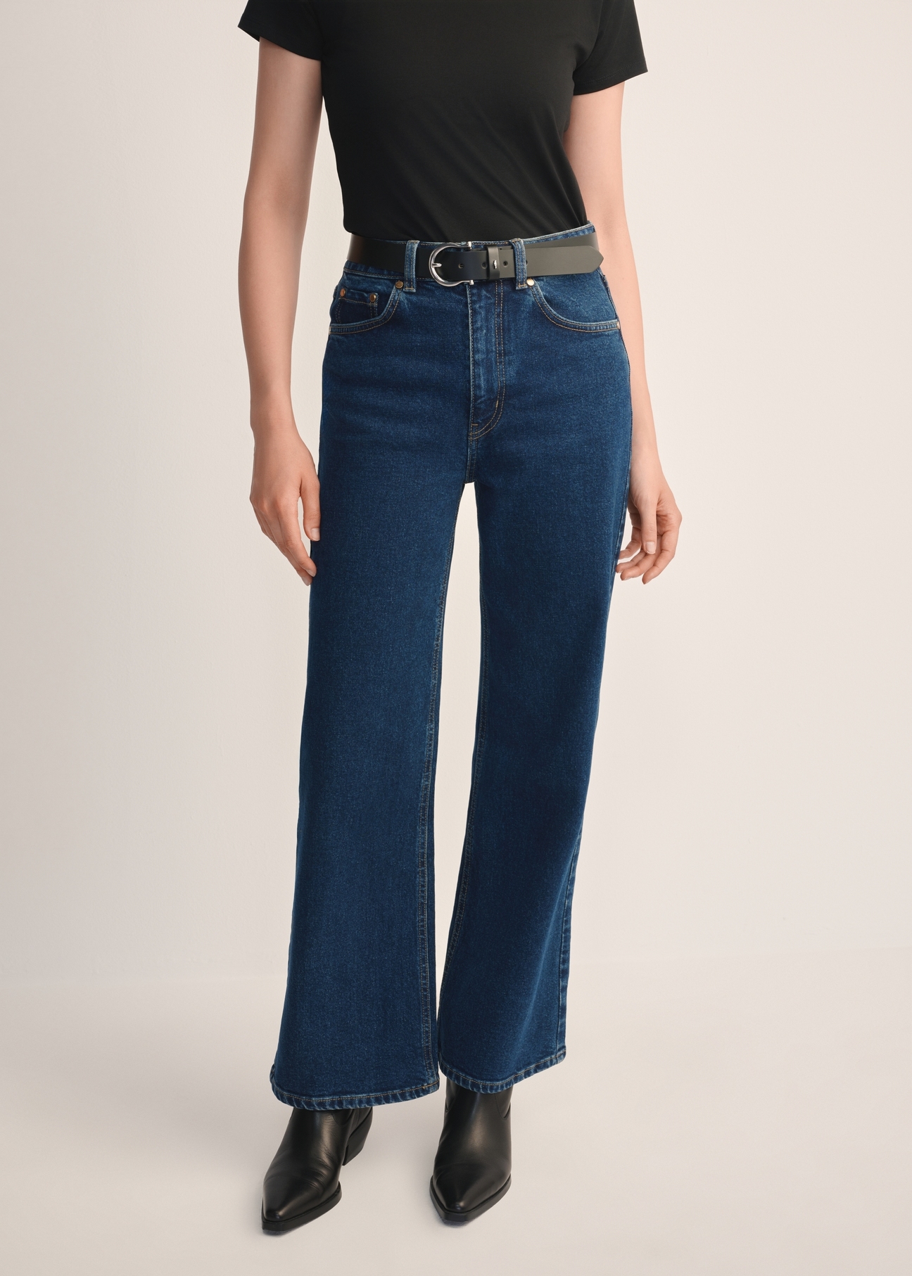 Women's navy blue denim pants JEADT-0013-69(Z25), front view of the product on the model. Half of the silhouette visible.